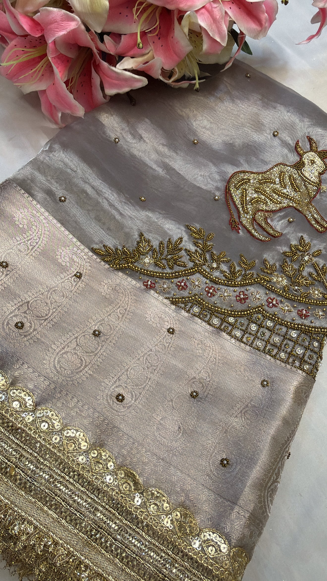 Metallic grey nandi motif hand embroidered tissue silk saree