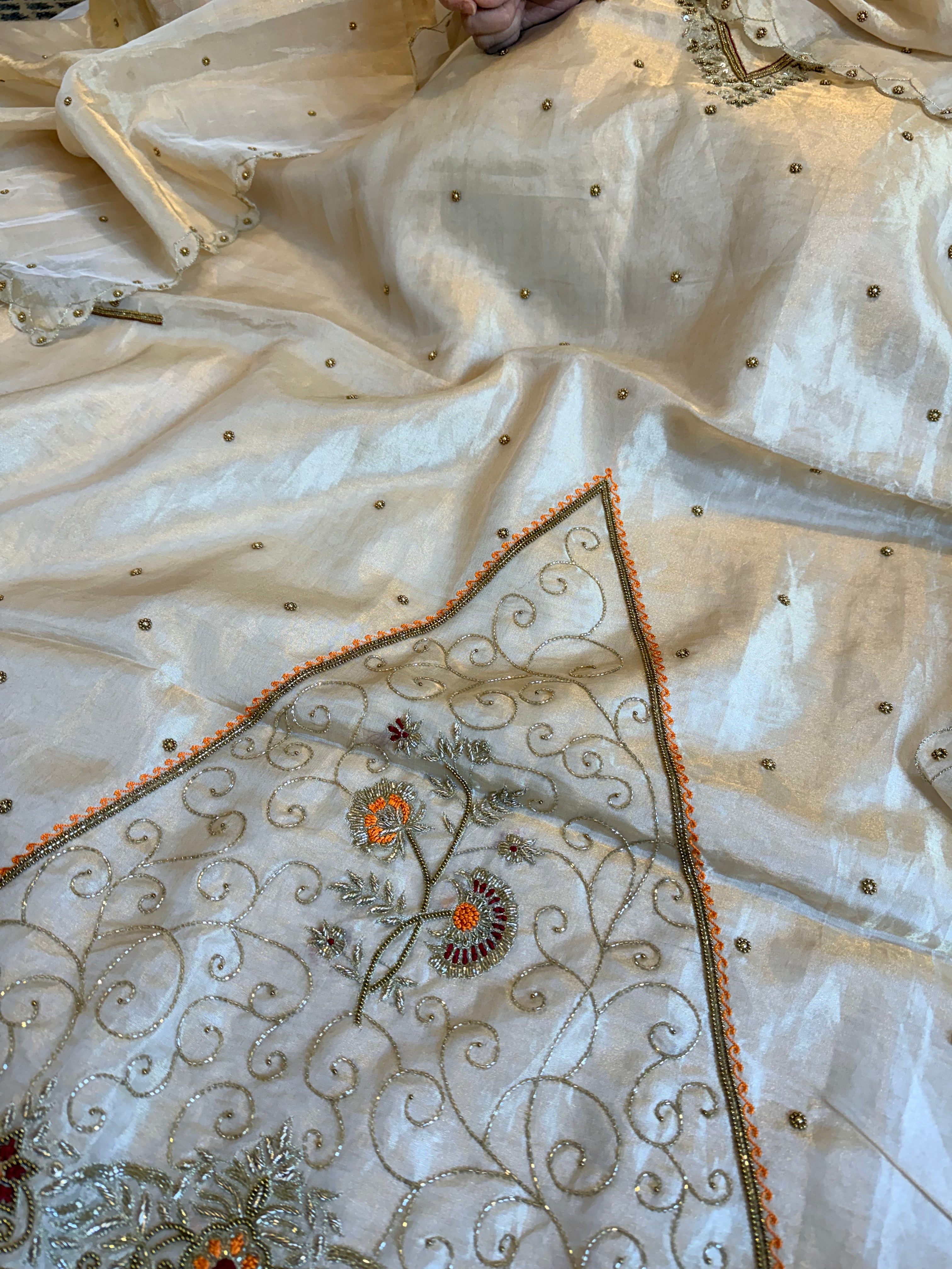 Golden tissue silk meenakari weaving hand embroidered suits