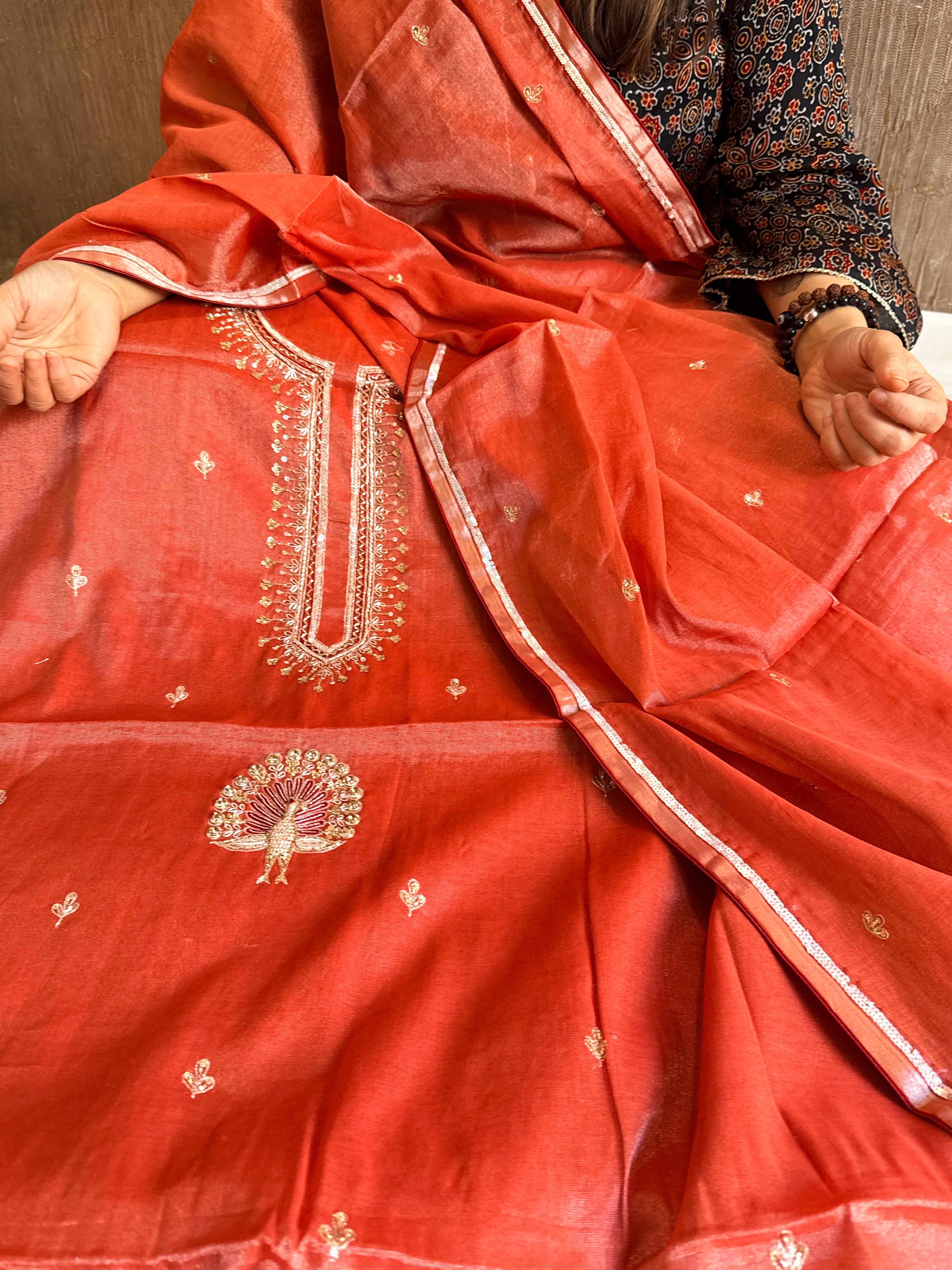 Reddish-orange mul tissue silk hand embroidered kadhwa suit set