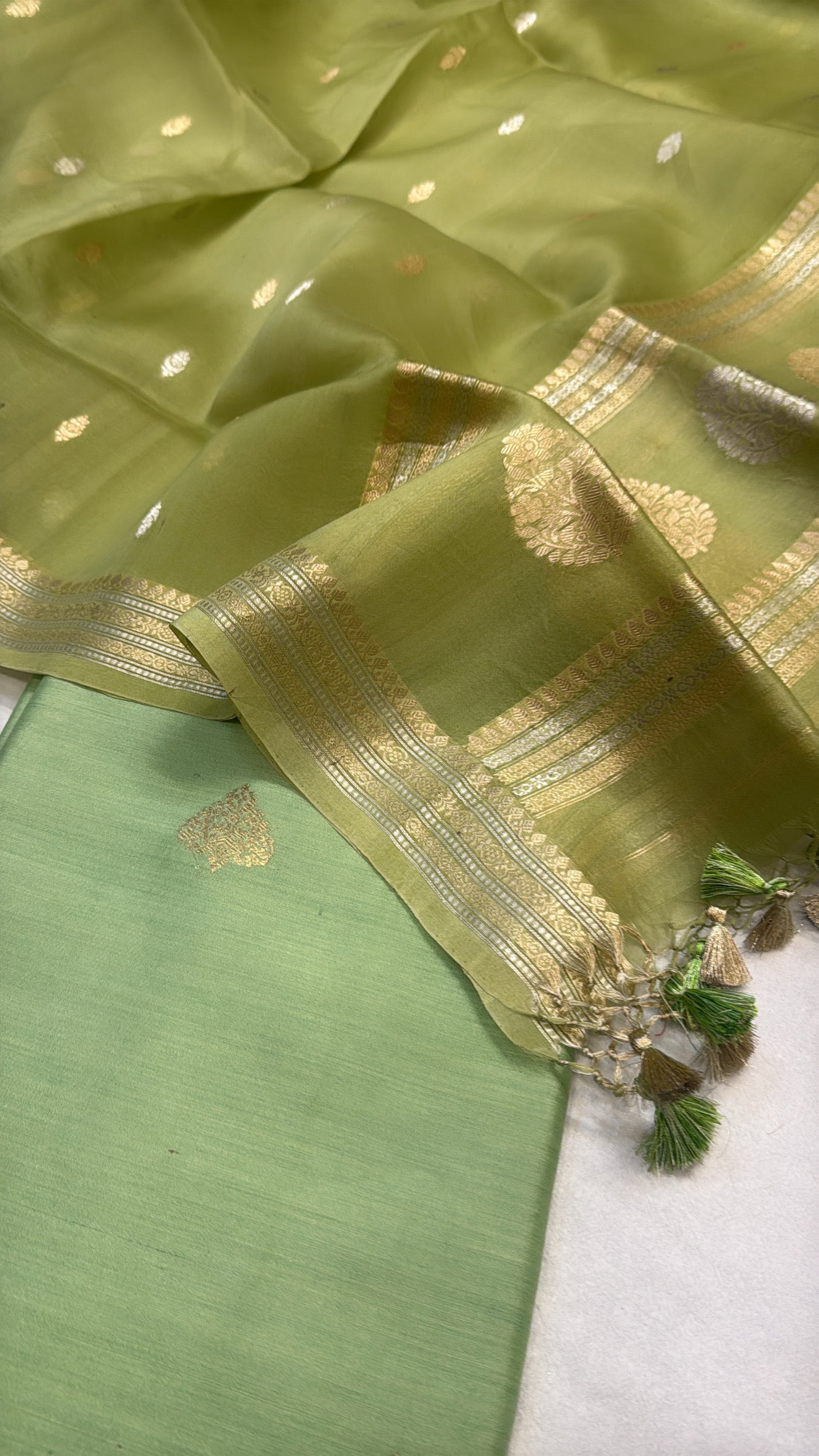 Tea green chiniya silk kurta paired with kora silk kadhwa duppata