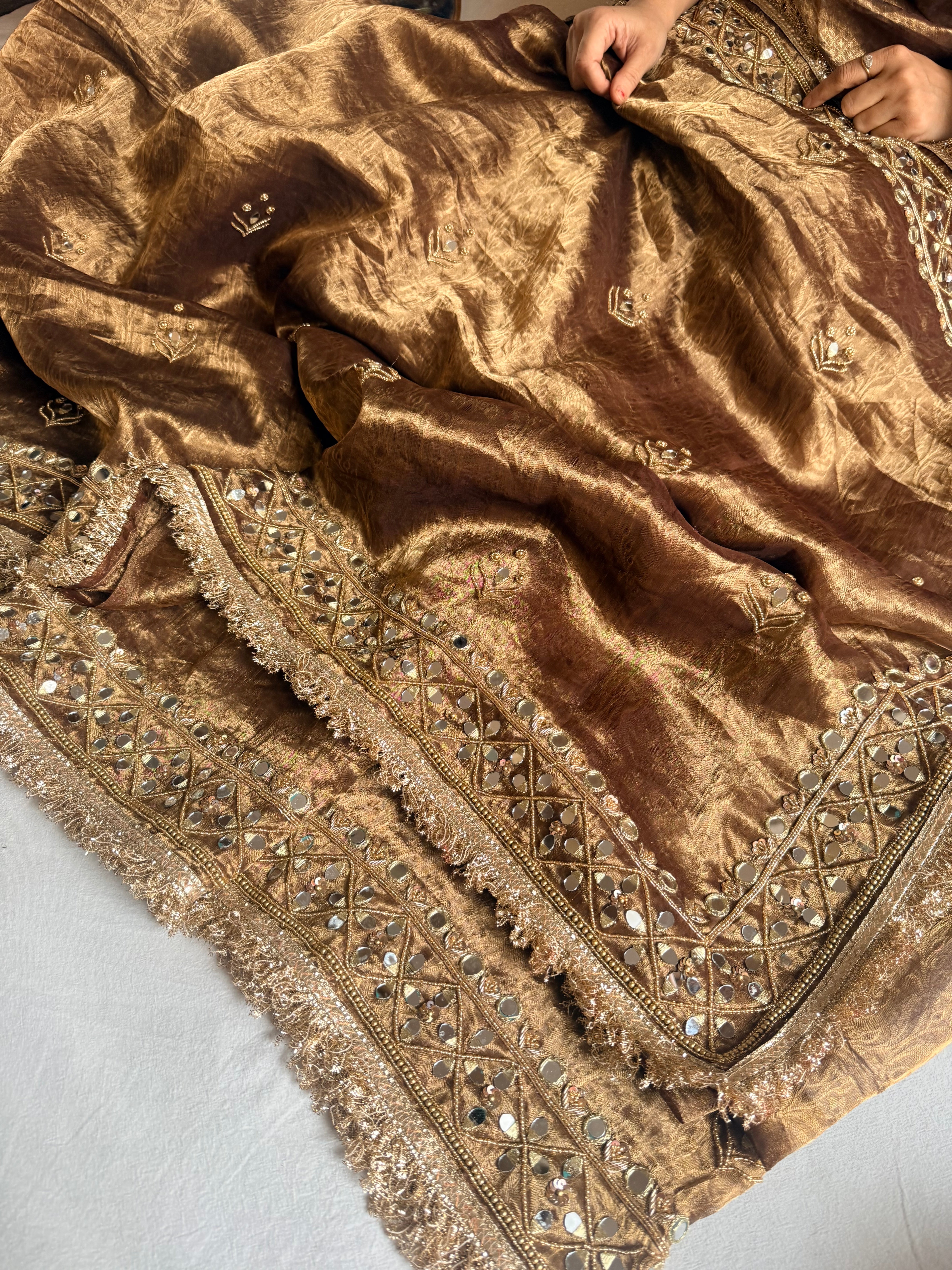 Molten antique gold tissue silk mirrorwork hand embroidered saree