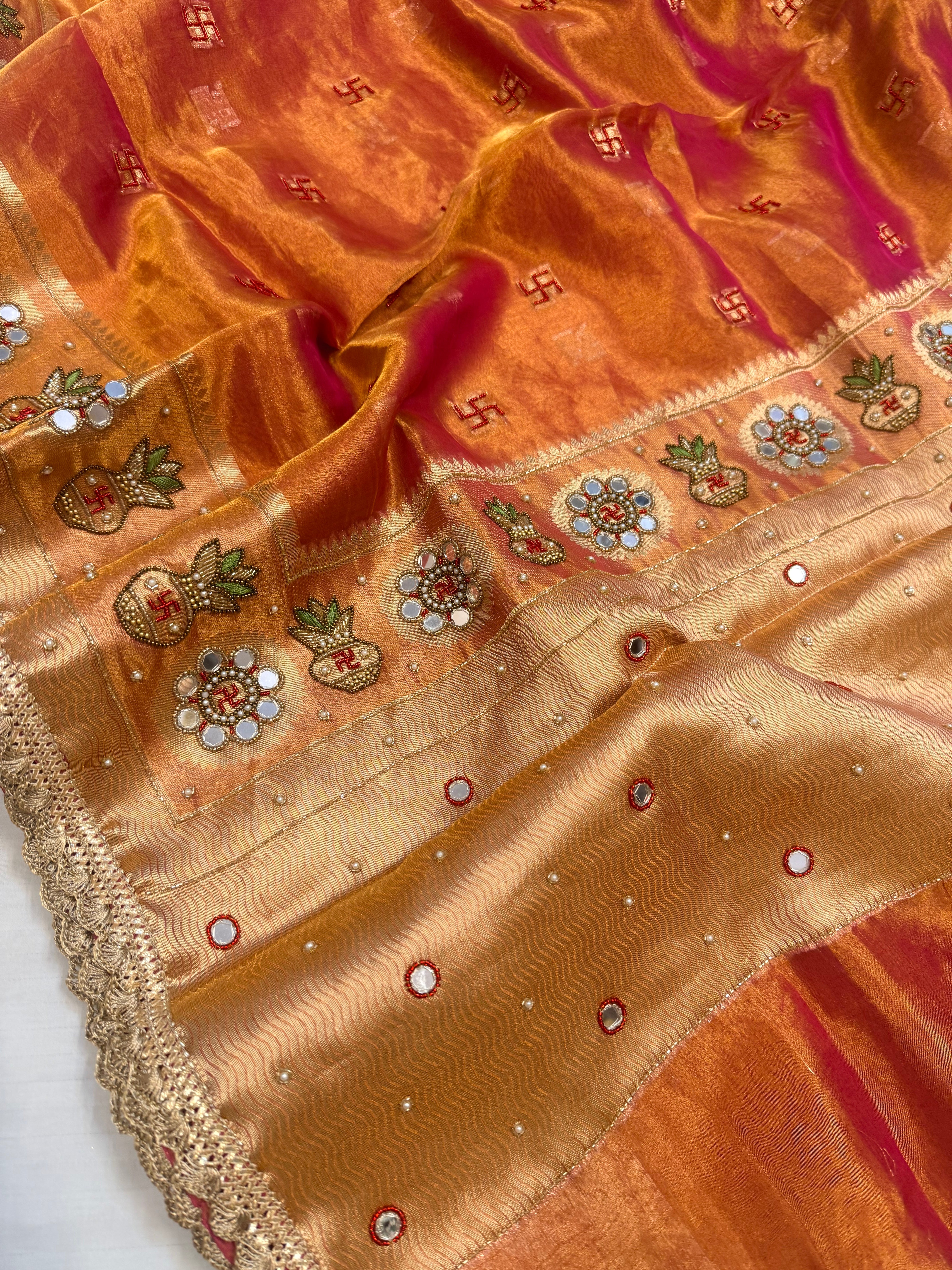 Metallic rani-orange dhup chao tissue silk hand embroidered mirrorwork saree