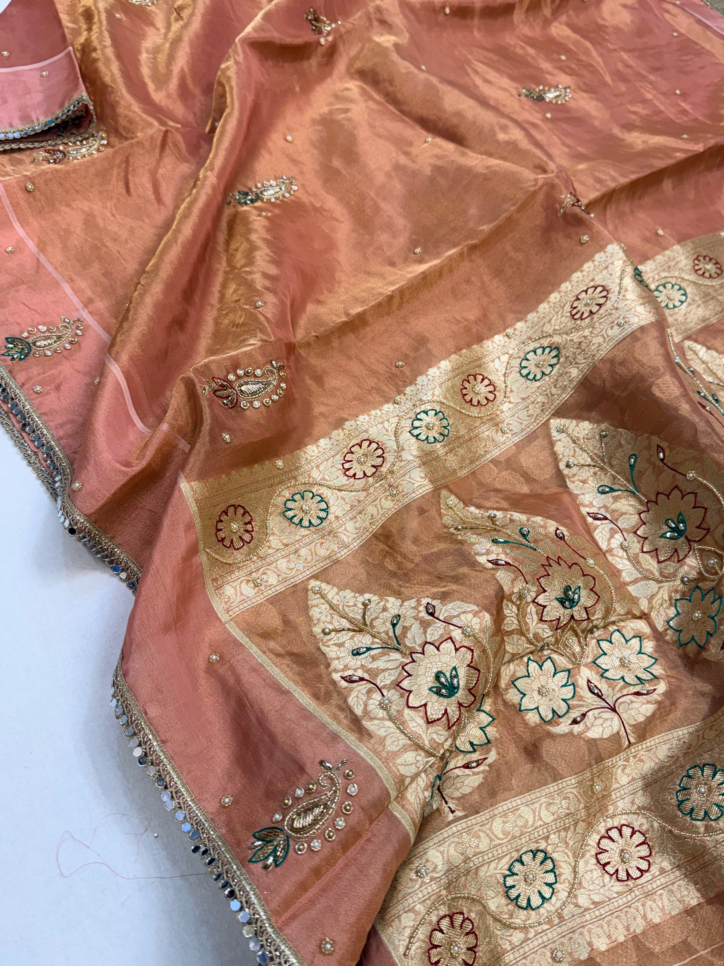 Peachy pink tissue silk hand embroidered kadhwa saree