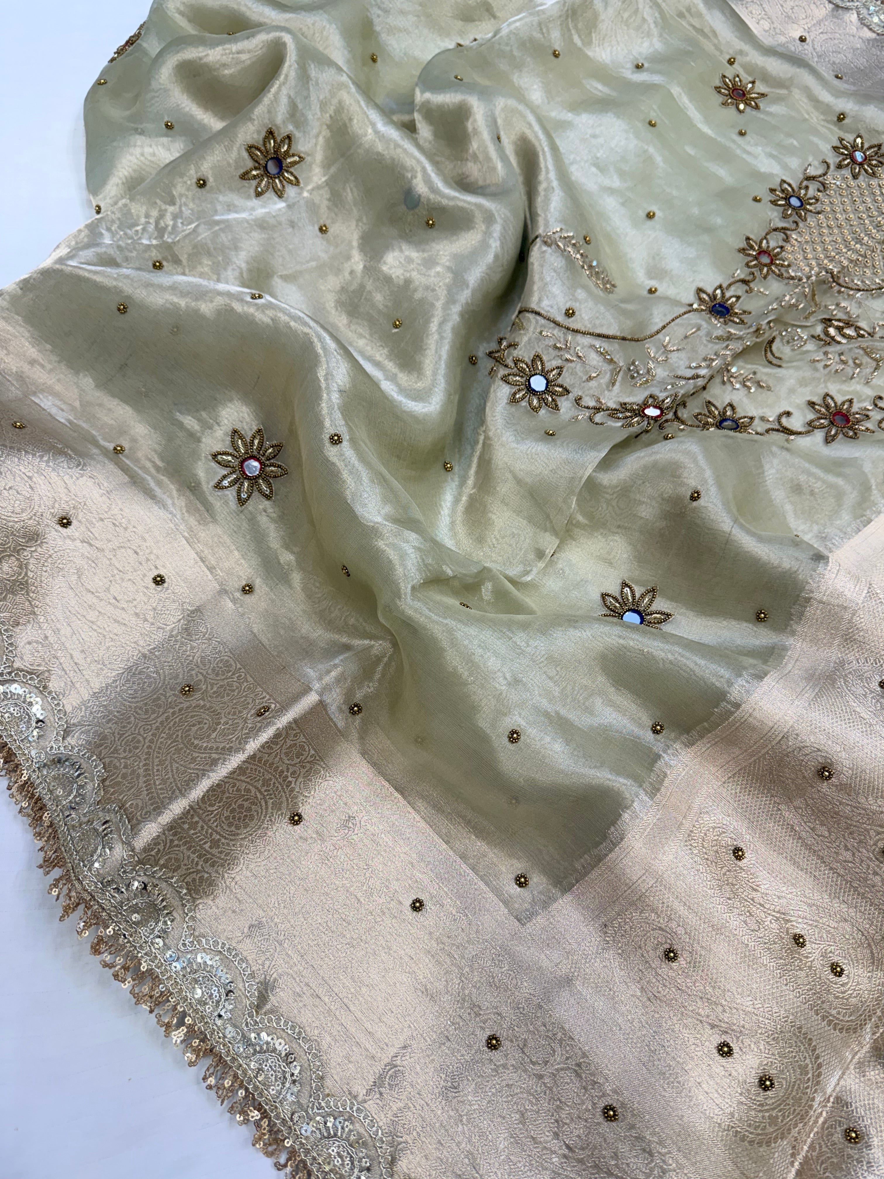 Mint green husn tissue silk carry motif hand embroidered saree