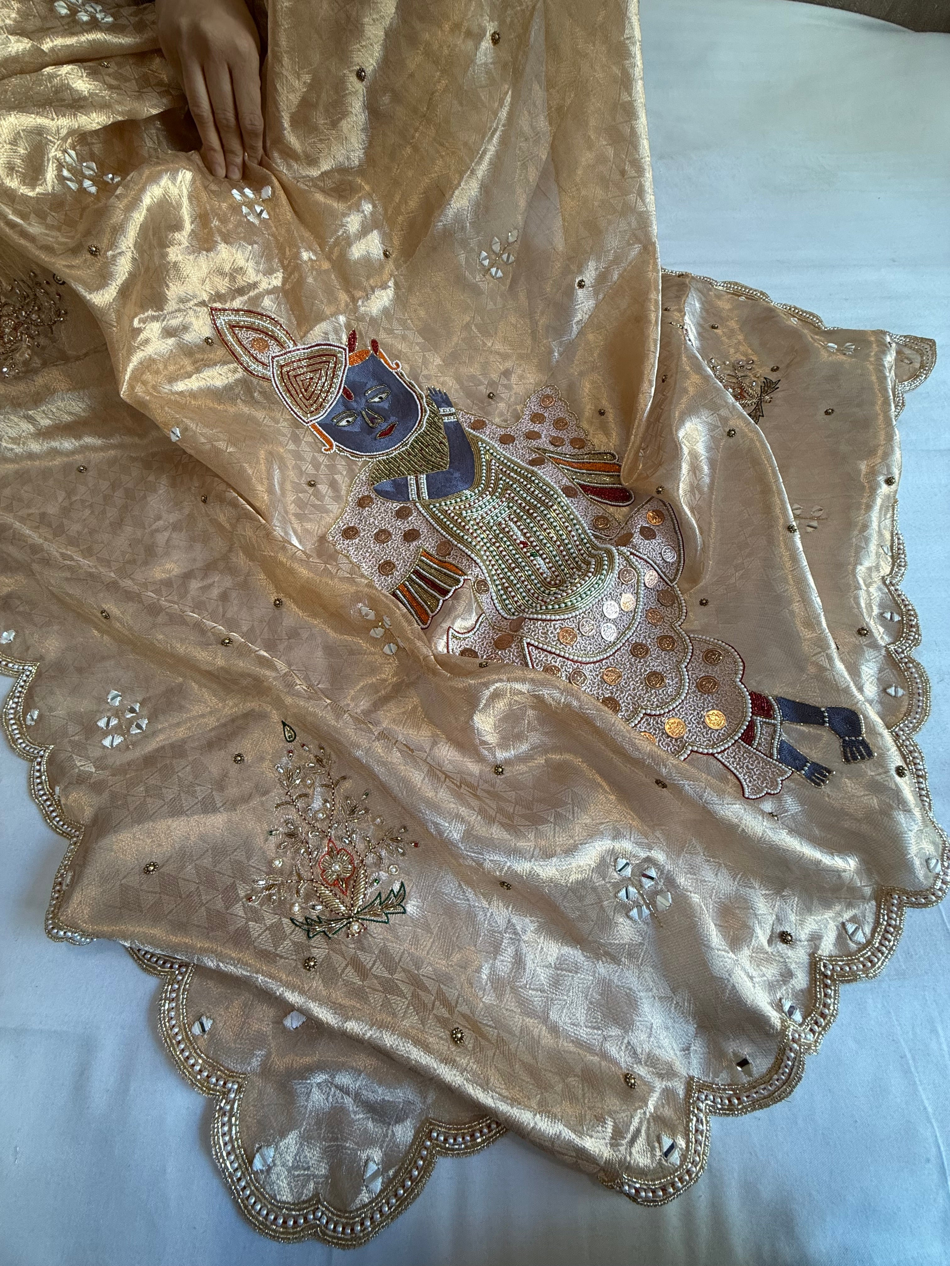 Shrinathji motif inspired molten tissue brocade kadhwa weaving hand embroidered saree