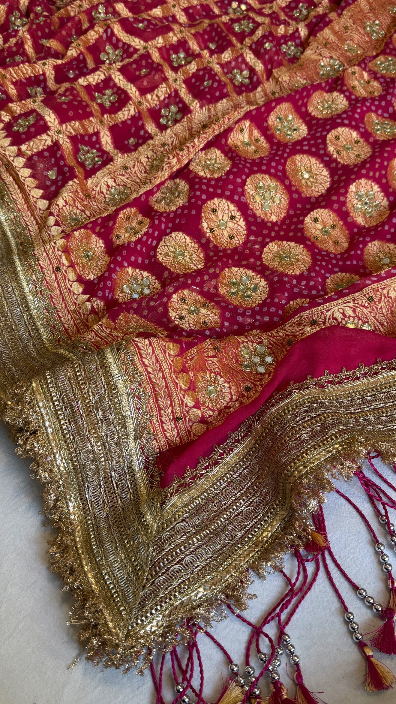 Cherry pink rai bandhej mirror work banarasi gorgette saree with long latkans