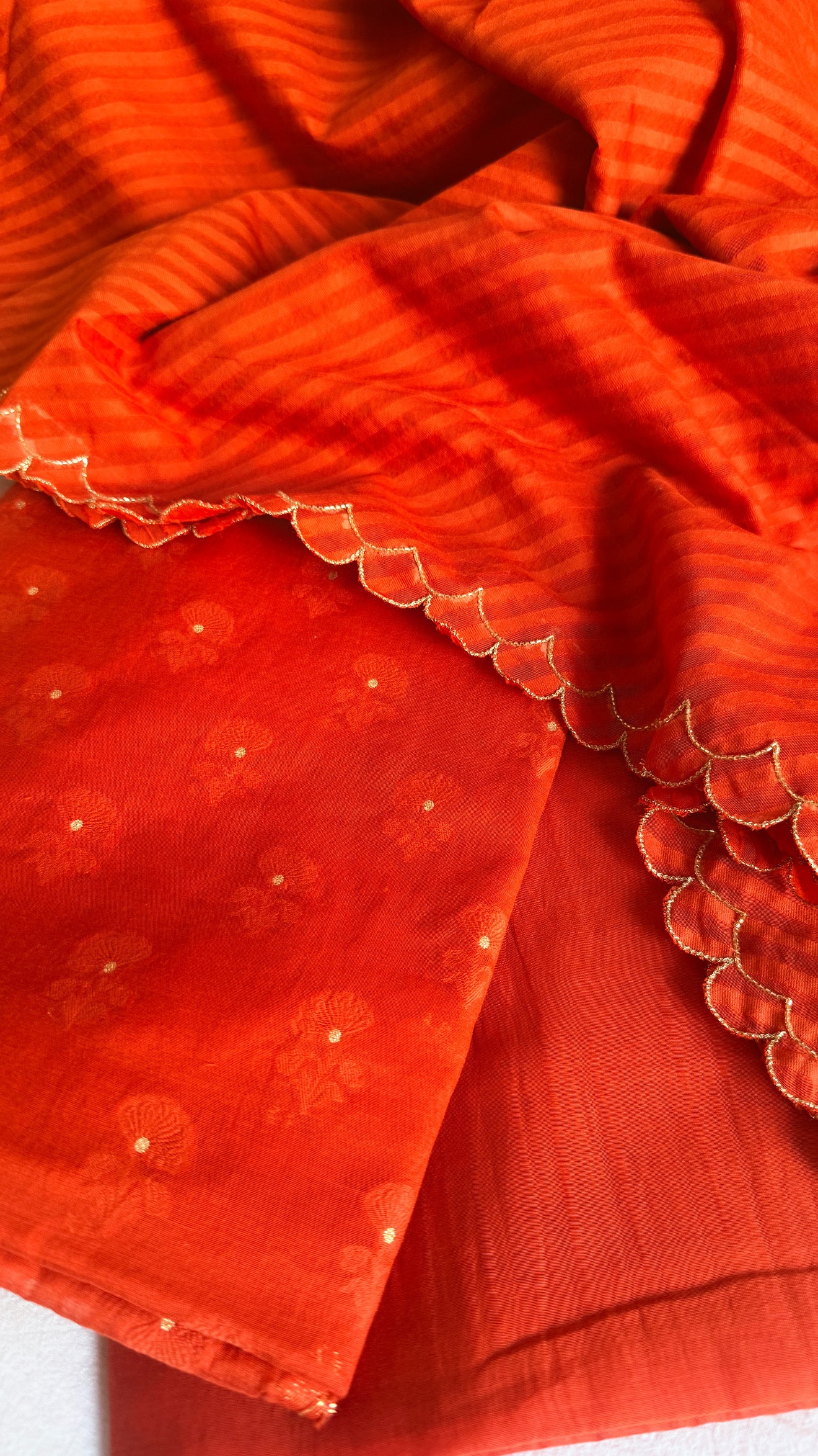 Summer suits under 8k - Mul cotton burnt orange kurta paired with cotton sscalloped duppata set