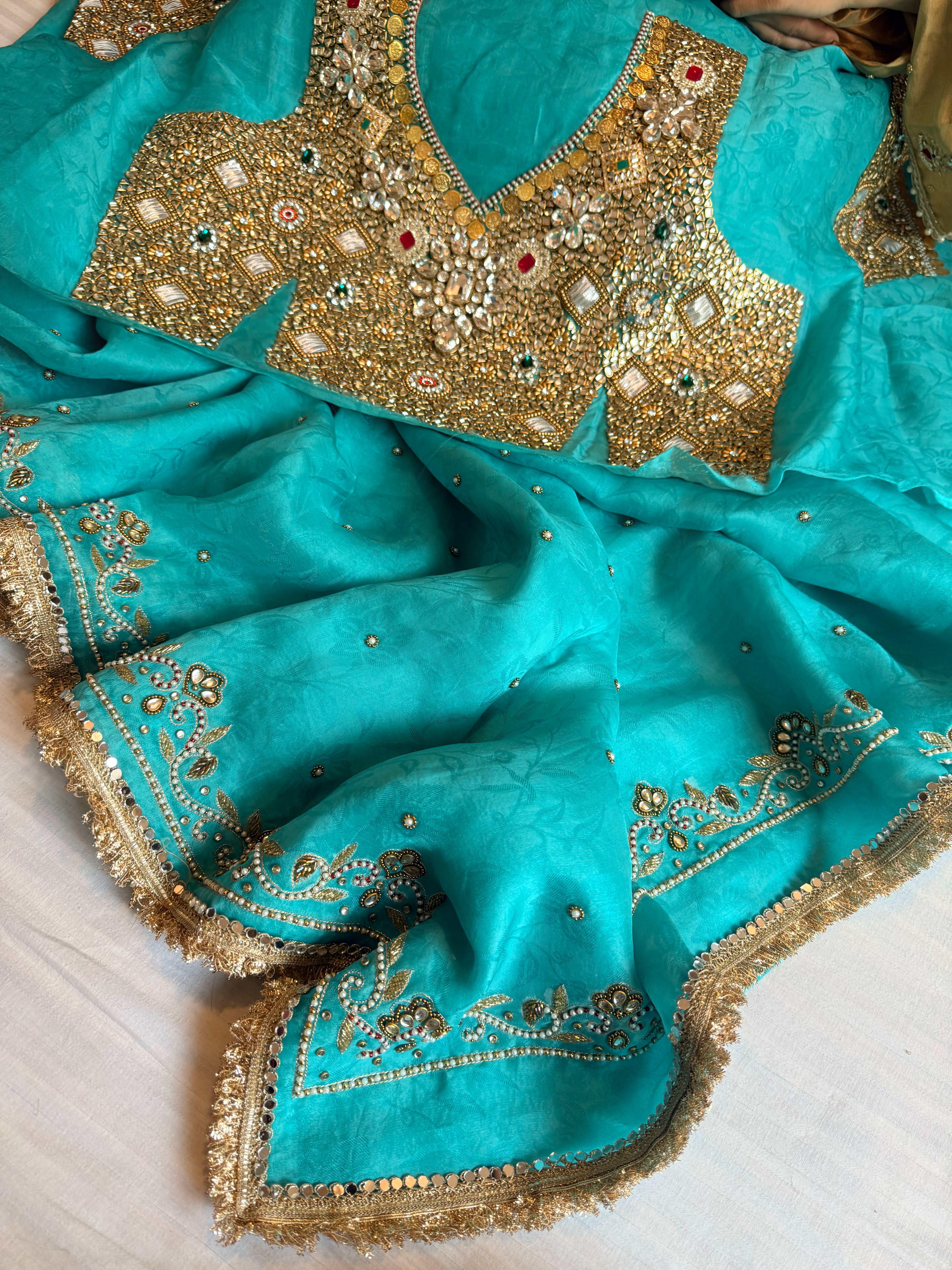 Jadauwork tissue tanchoi silk hand embroidered kadhwa saree