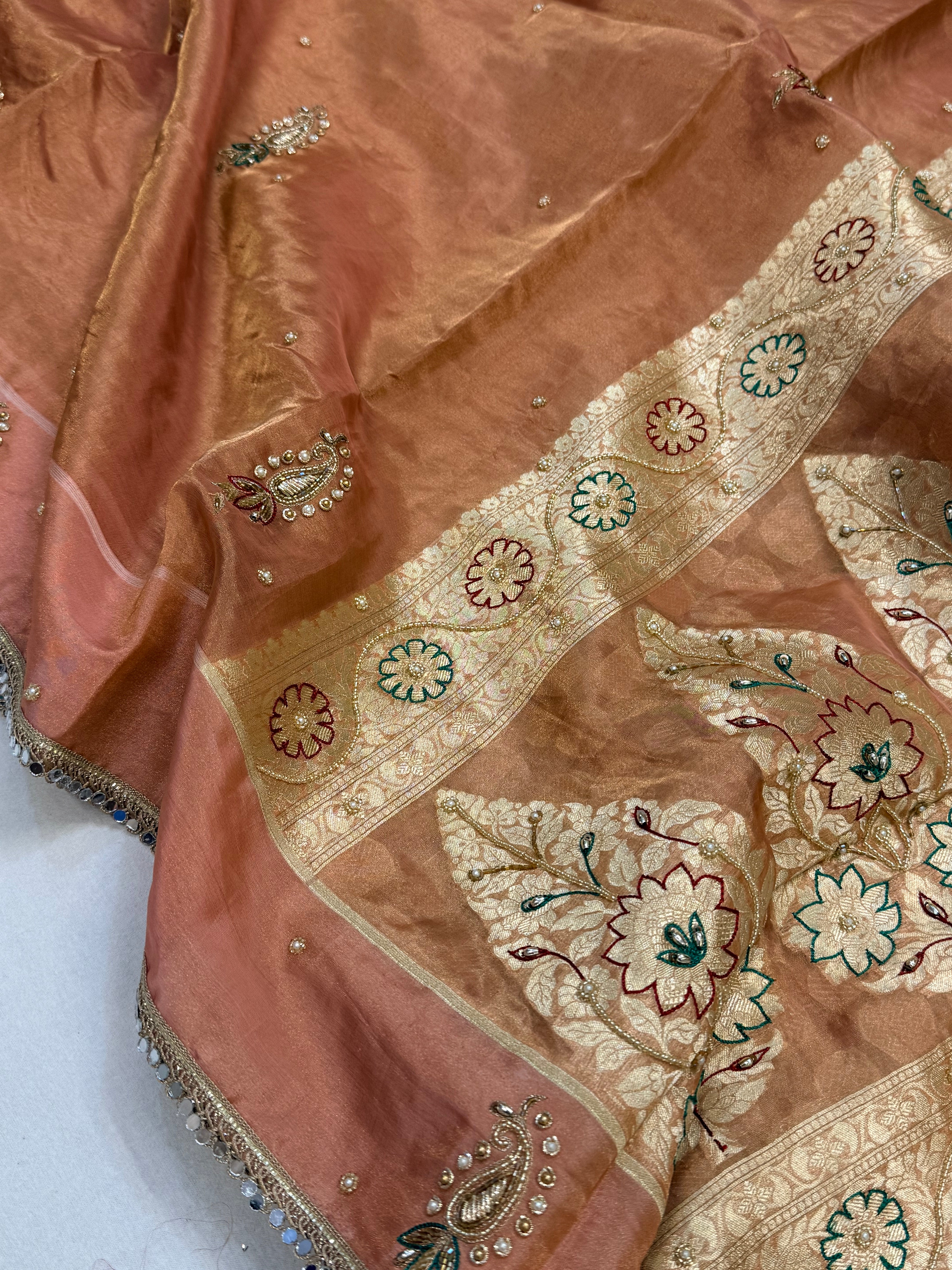 Peachy pink tissue silk hand embroidered kadhwa saree