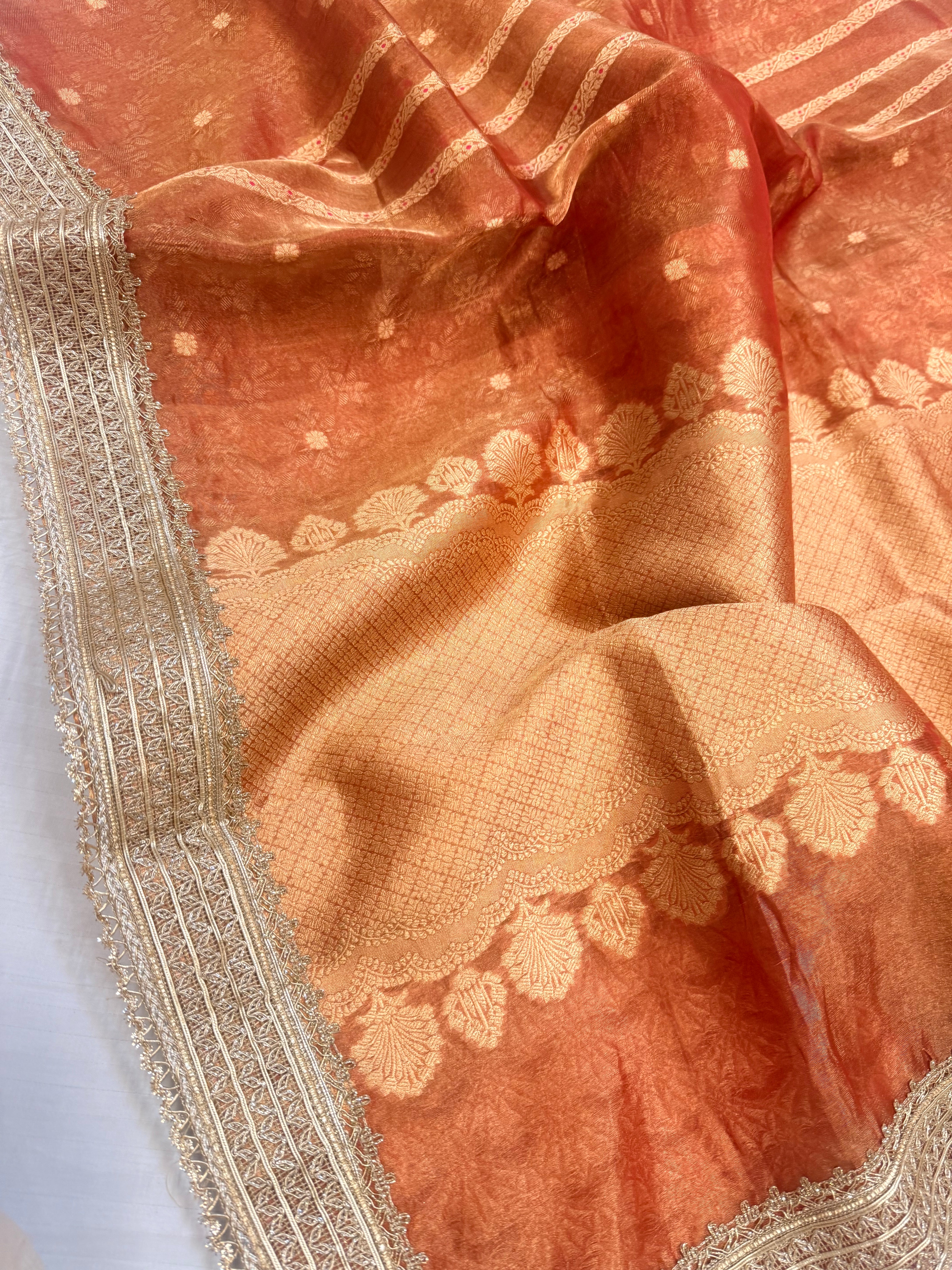 Tangerine red tissue silk kadhwa buti and striped gotapatti saree