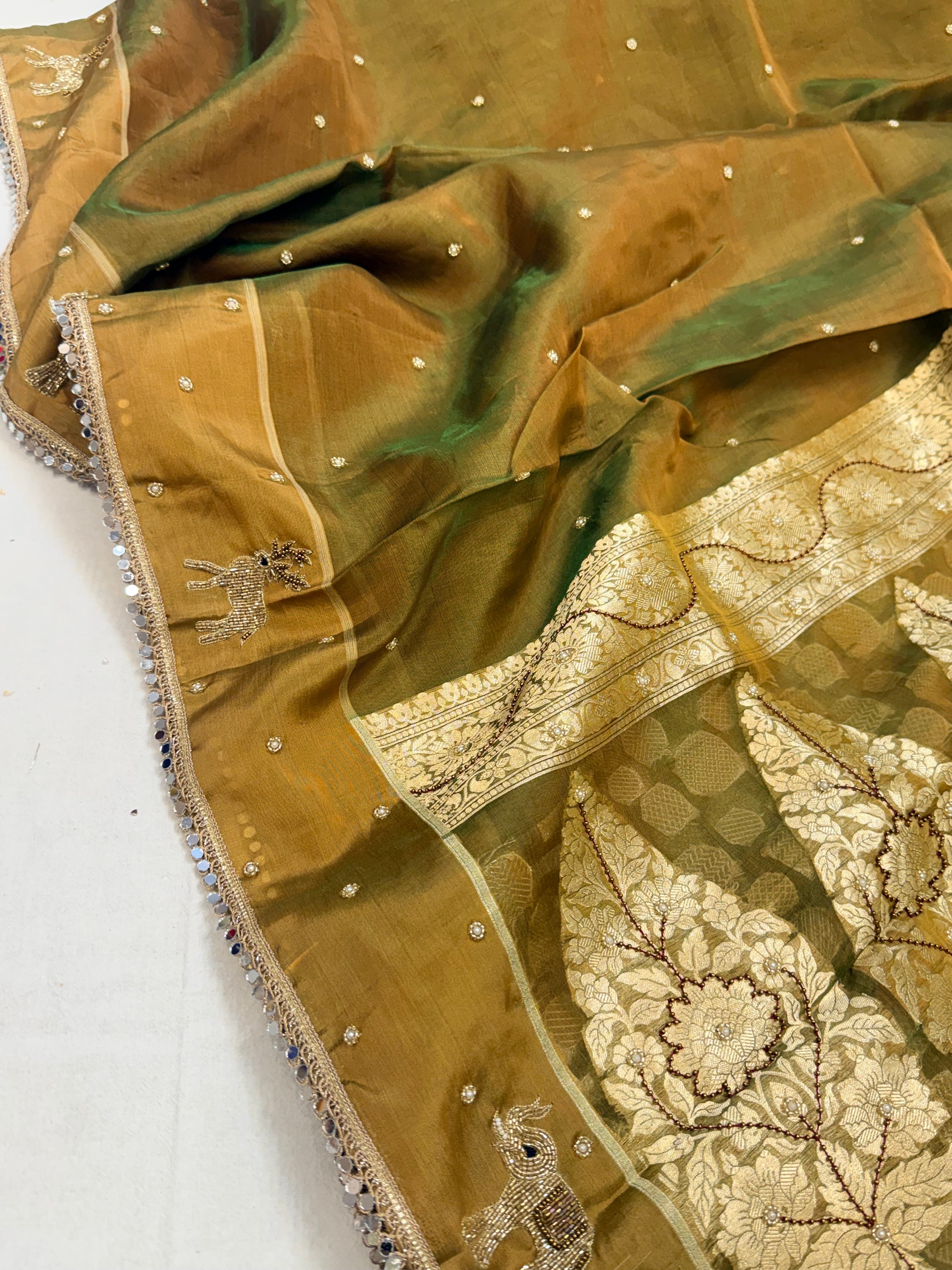 Mehendi green dhup chao effect tissue silk hand embroidered saree