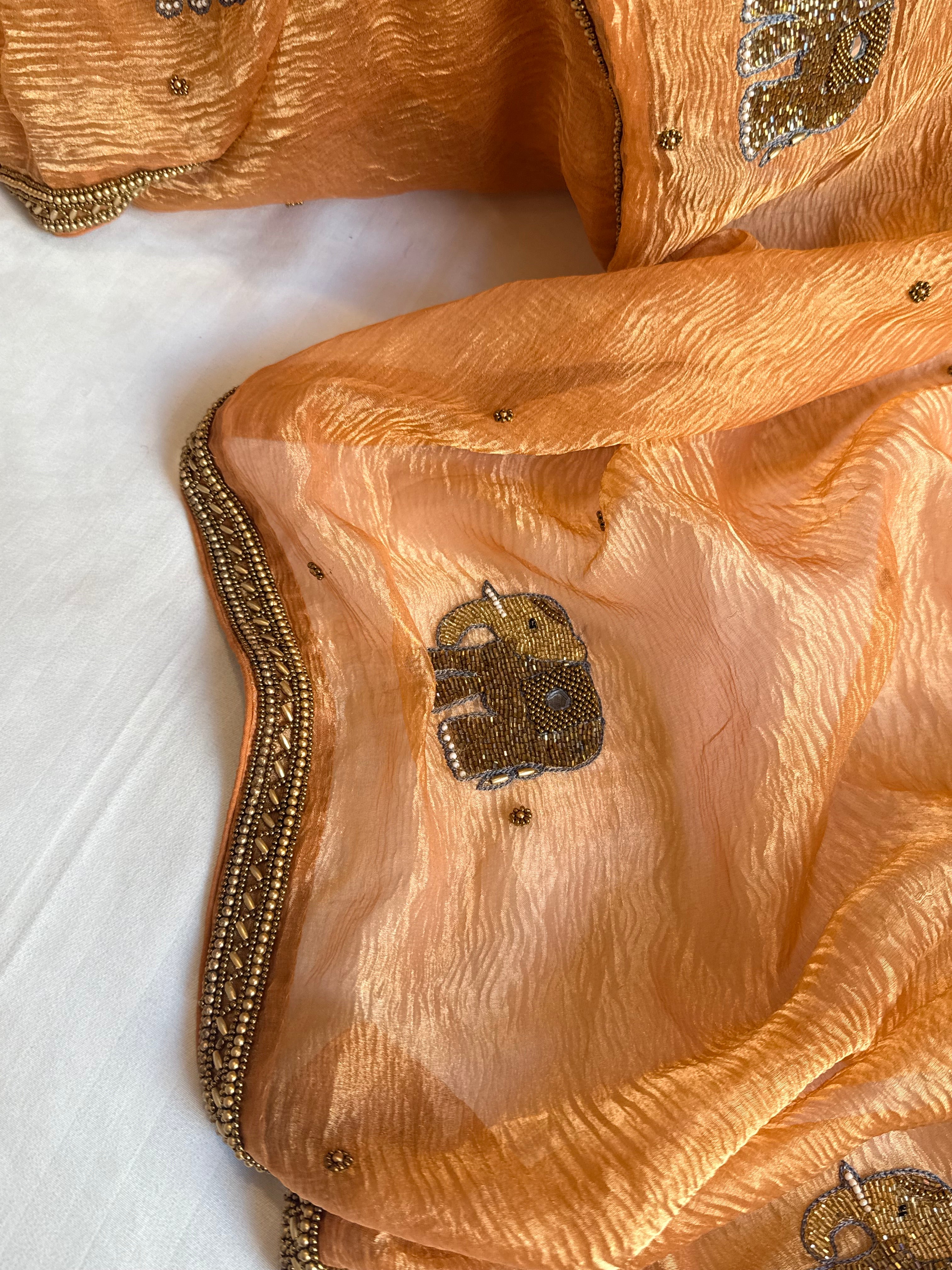 Mirrorwork edit gajri peach crushed tissue silk hand embroidered saree