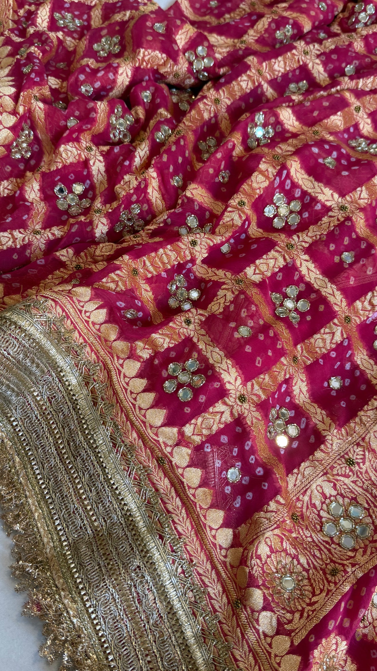 Cherry pink rai bandhej mirror work banarasi gorgette saree with long latkans