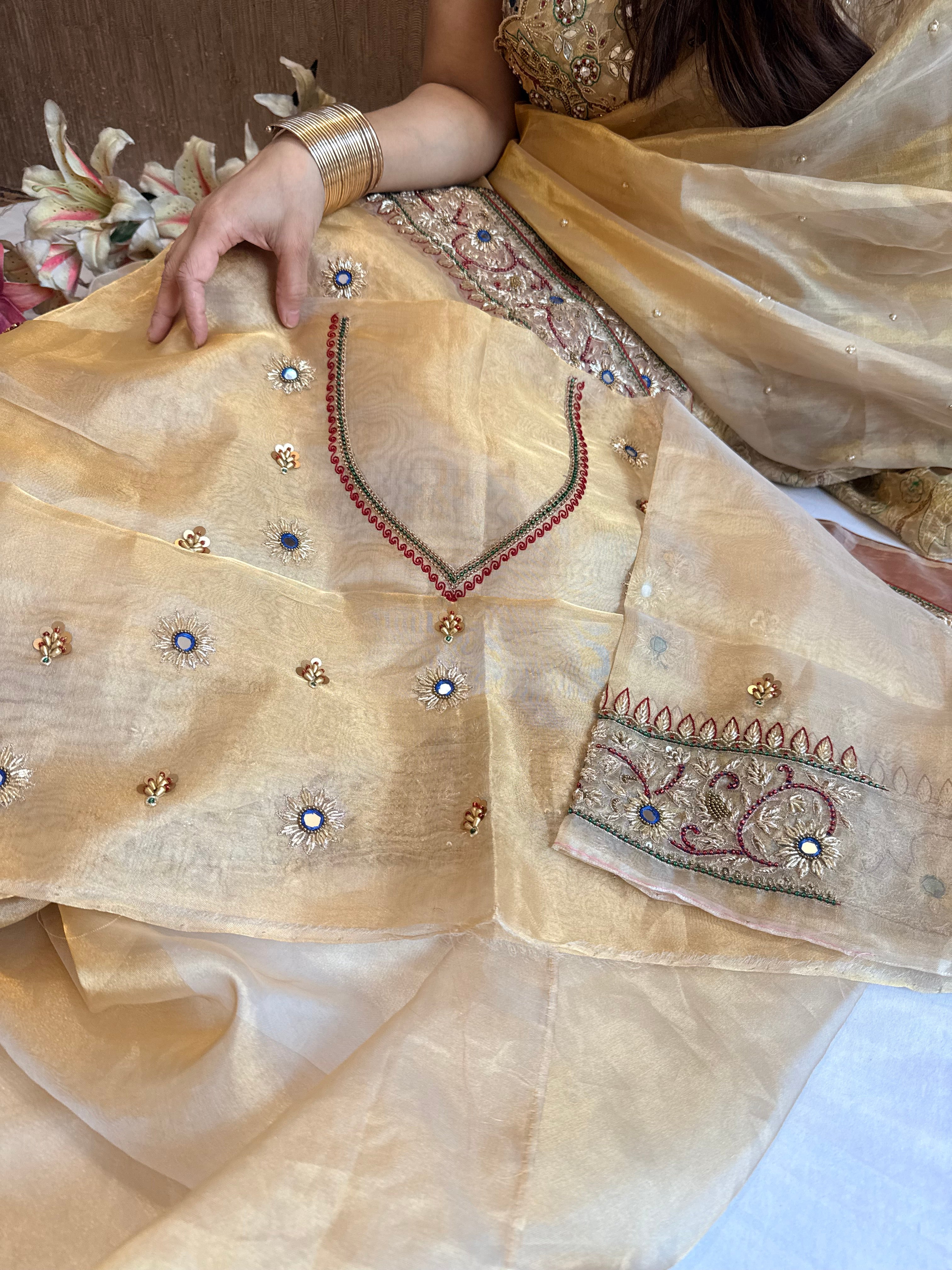 Zardozi & Jadauwork border tissue silk hand embroidered kadhwa butter gold saree