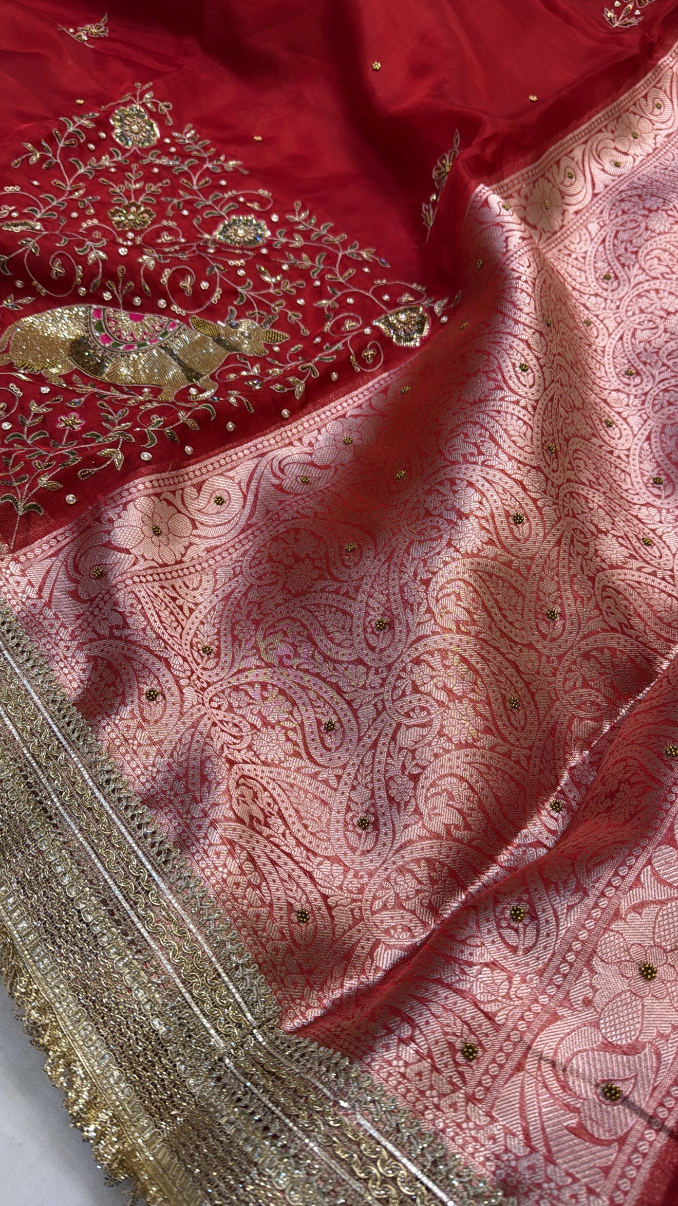 Blood red tissue silk nandi motif zardozi work hand embroidered saree