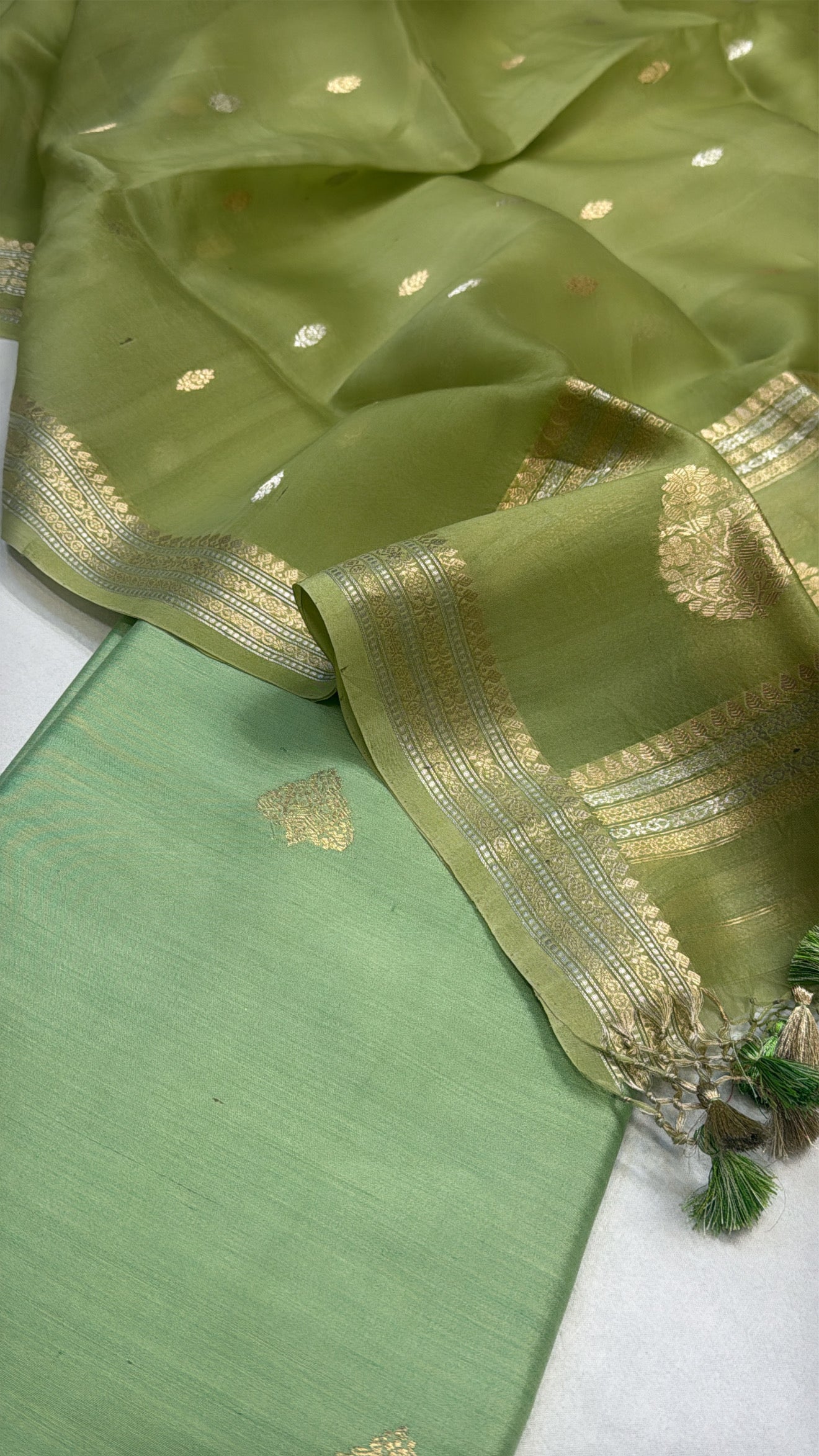 Tea green chiniya silk kurta paired with kora silk kadhwa duppata