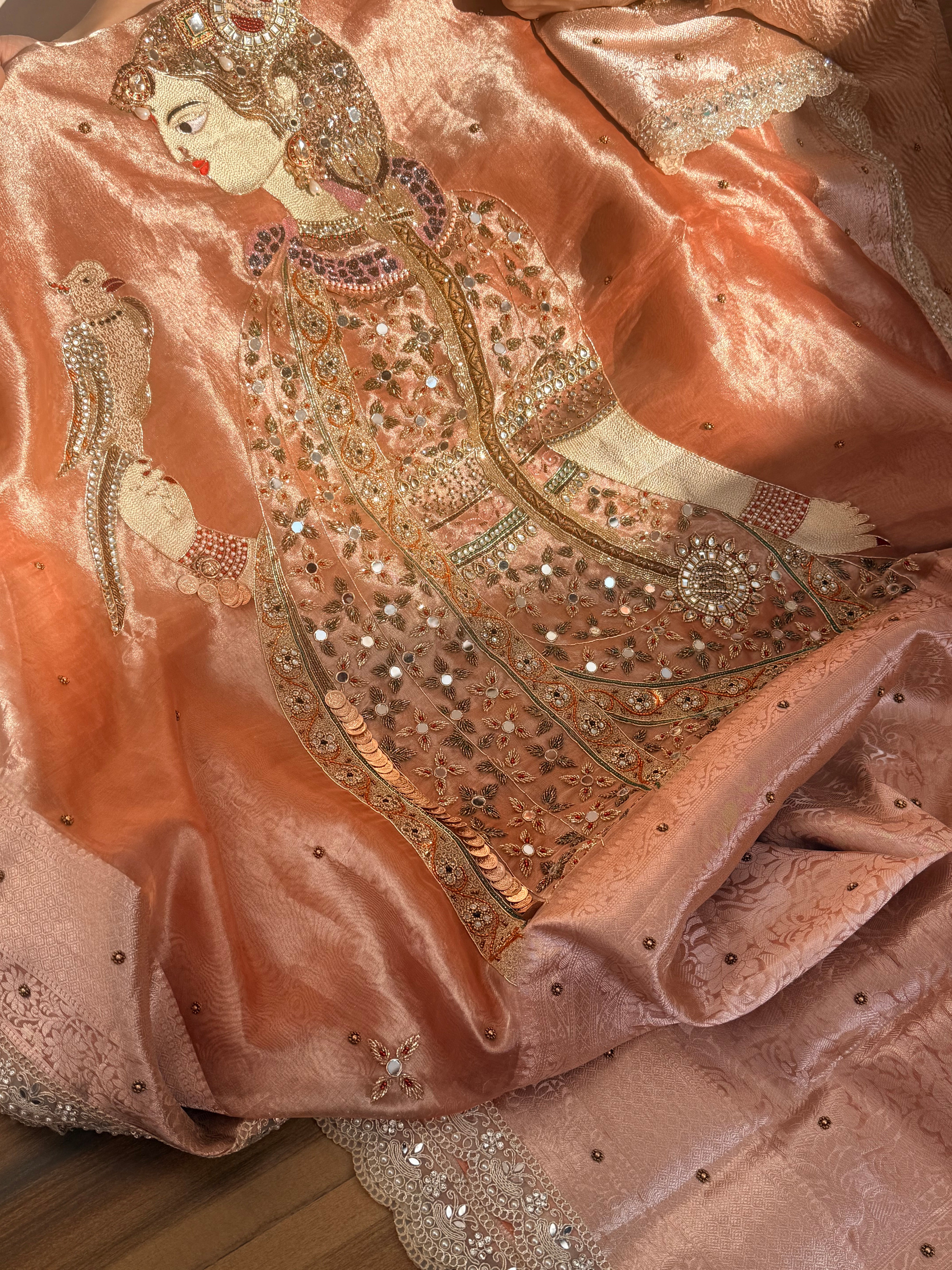 Heer saree with jadau necklace work hand embroidered tissue silk gajri peach saree
