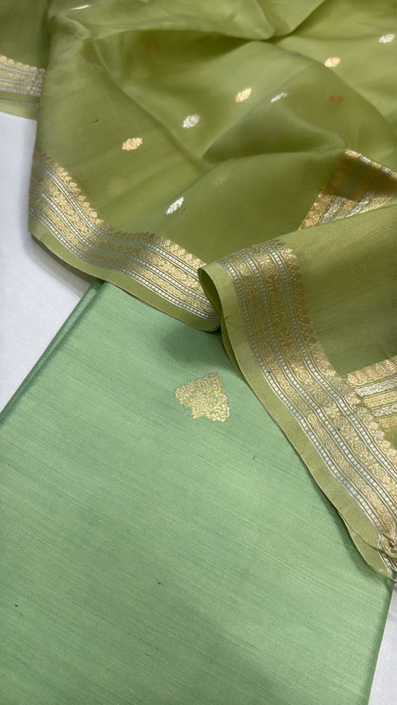 Tea green chiniya silk kurta paired with kora silk kadhwa duppata