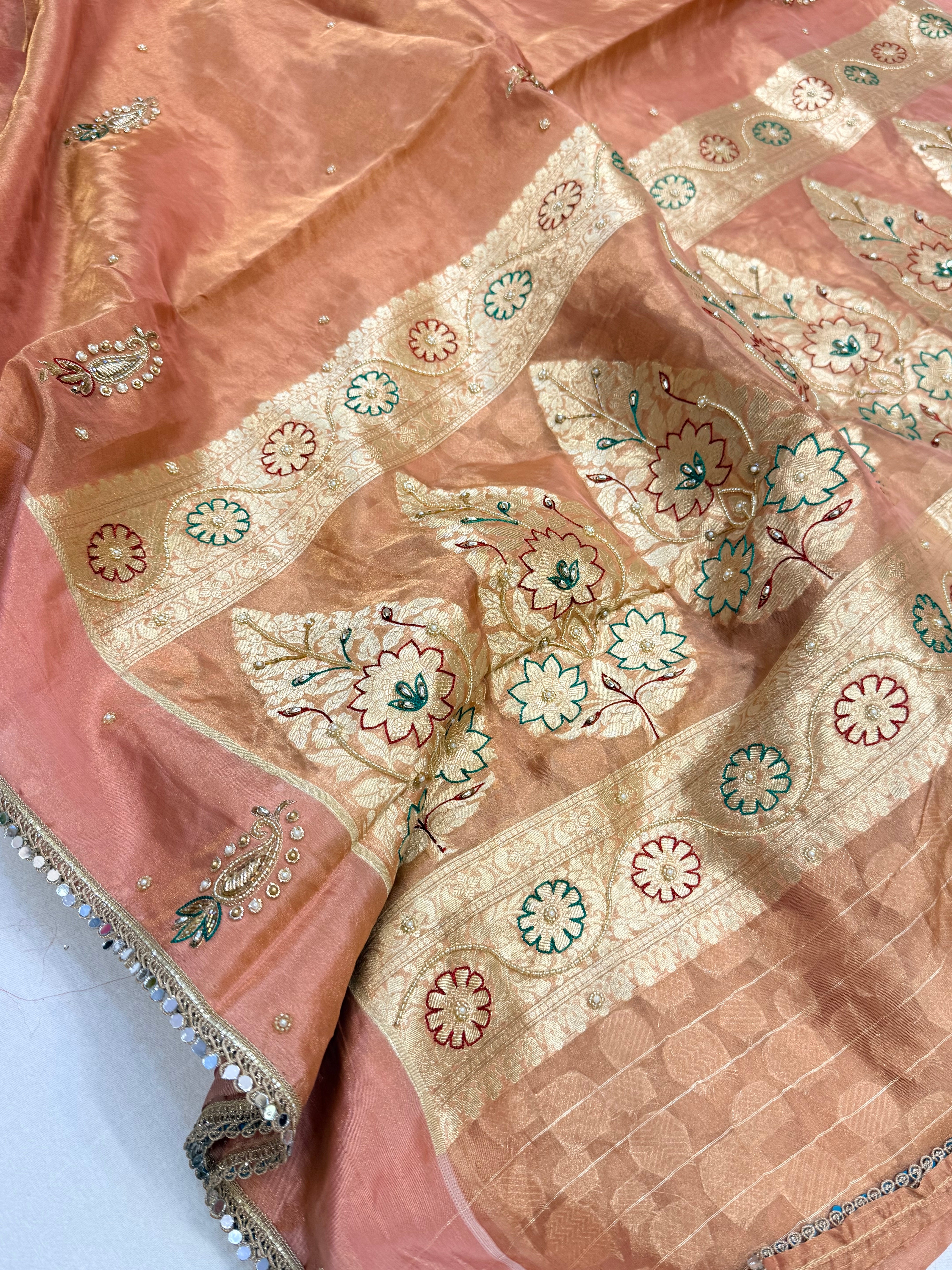 Peachy pink tissue silk hand embroidered kadhwa saree