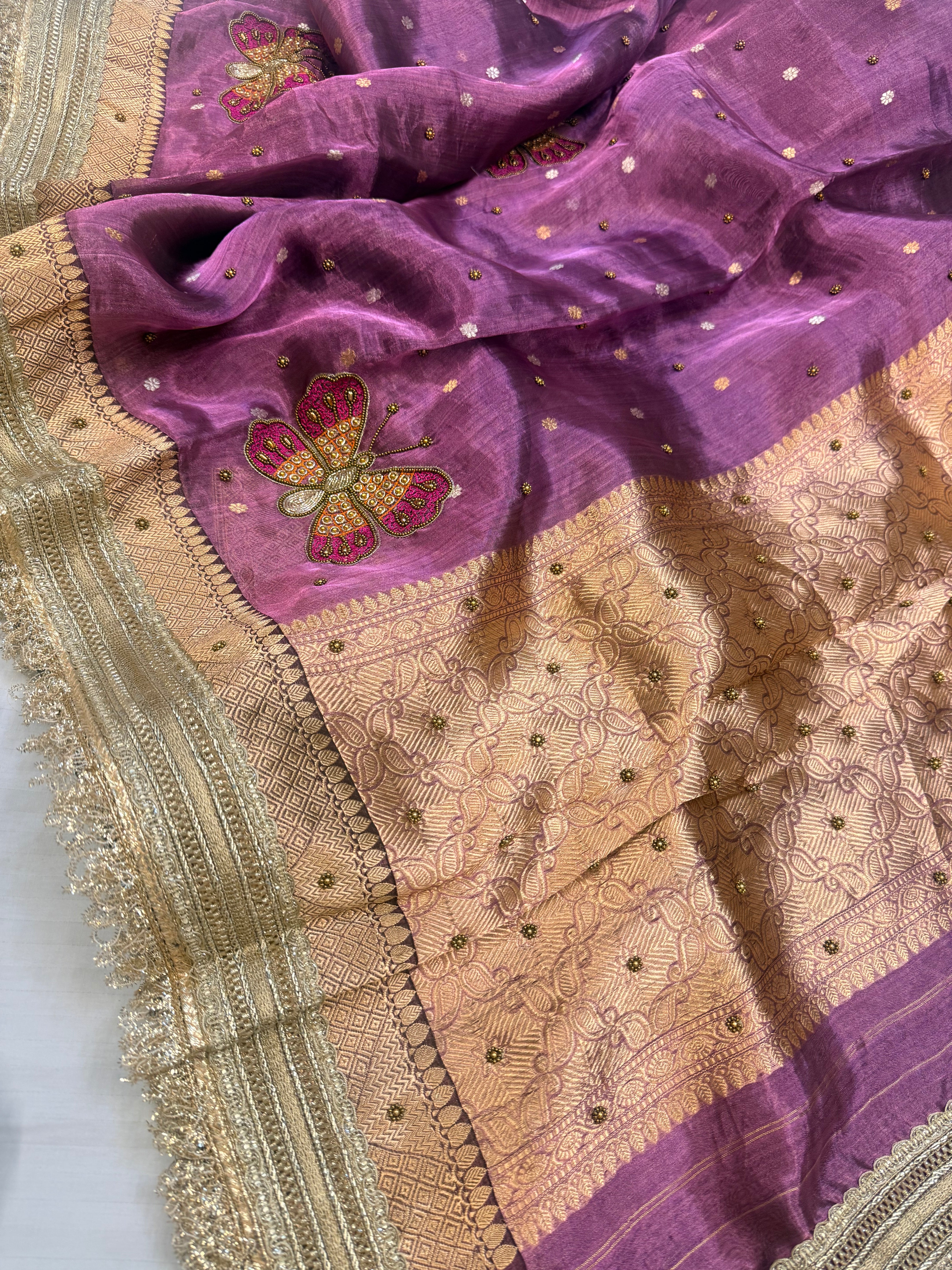 Metallic brinjal purple husn tissue silk hand embroidered saree