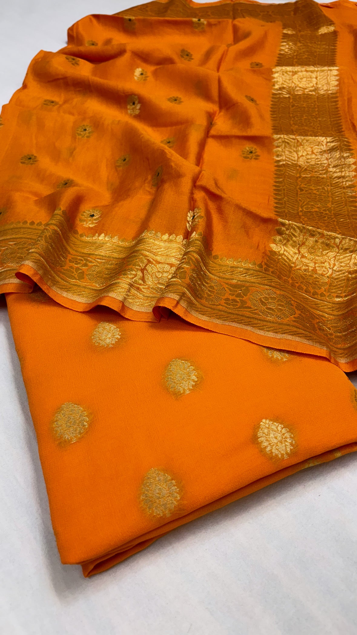 Bright mango gorgette kurta paired with moonga silk kadhwa duppata suit set