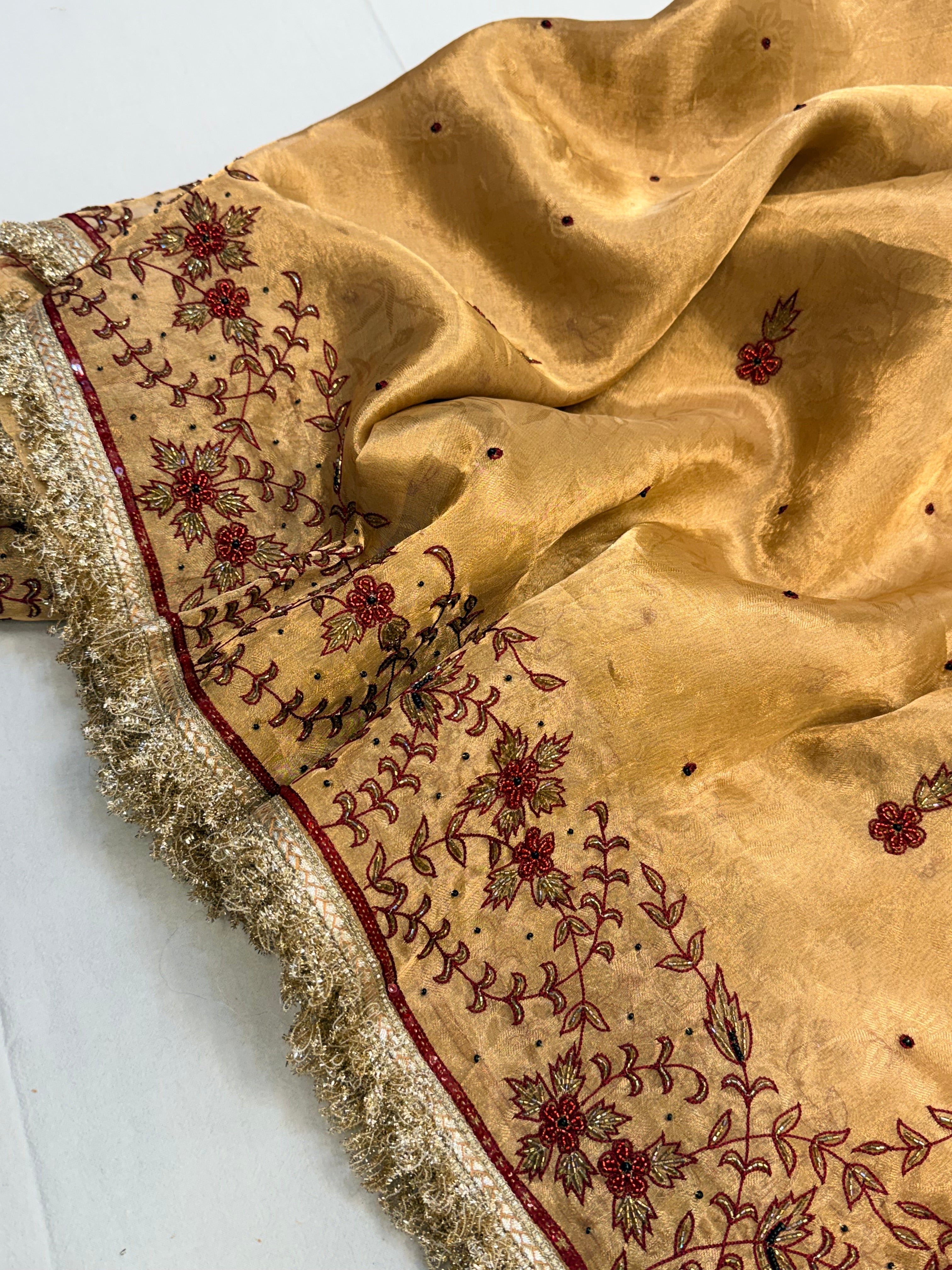 Molten gold tissue silk hand embroidered kadhwa saree