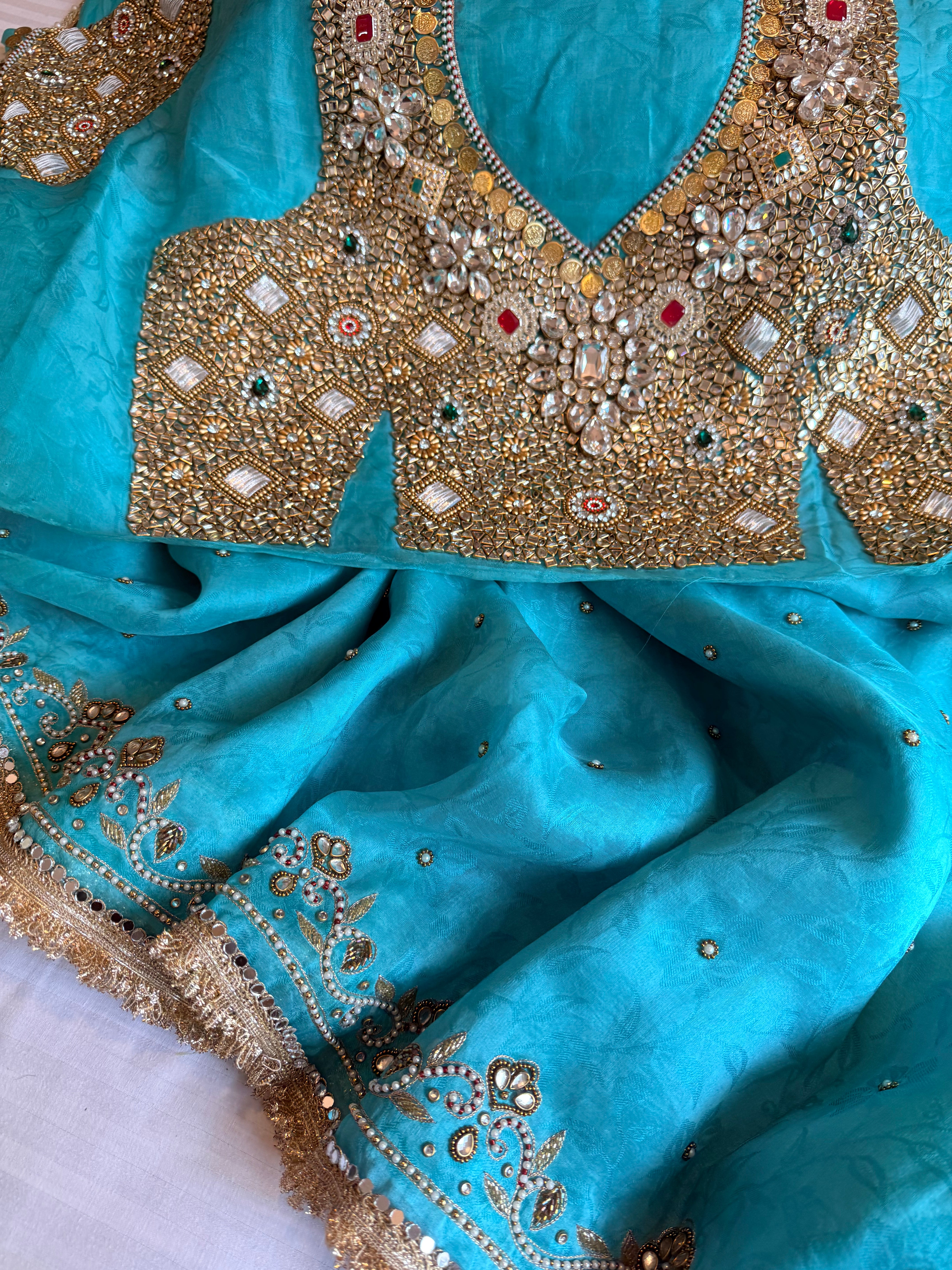 Jadauwork tissue tanchoi silk hand embroidered kadhwa saree
