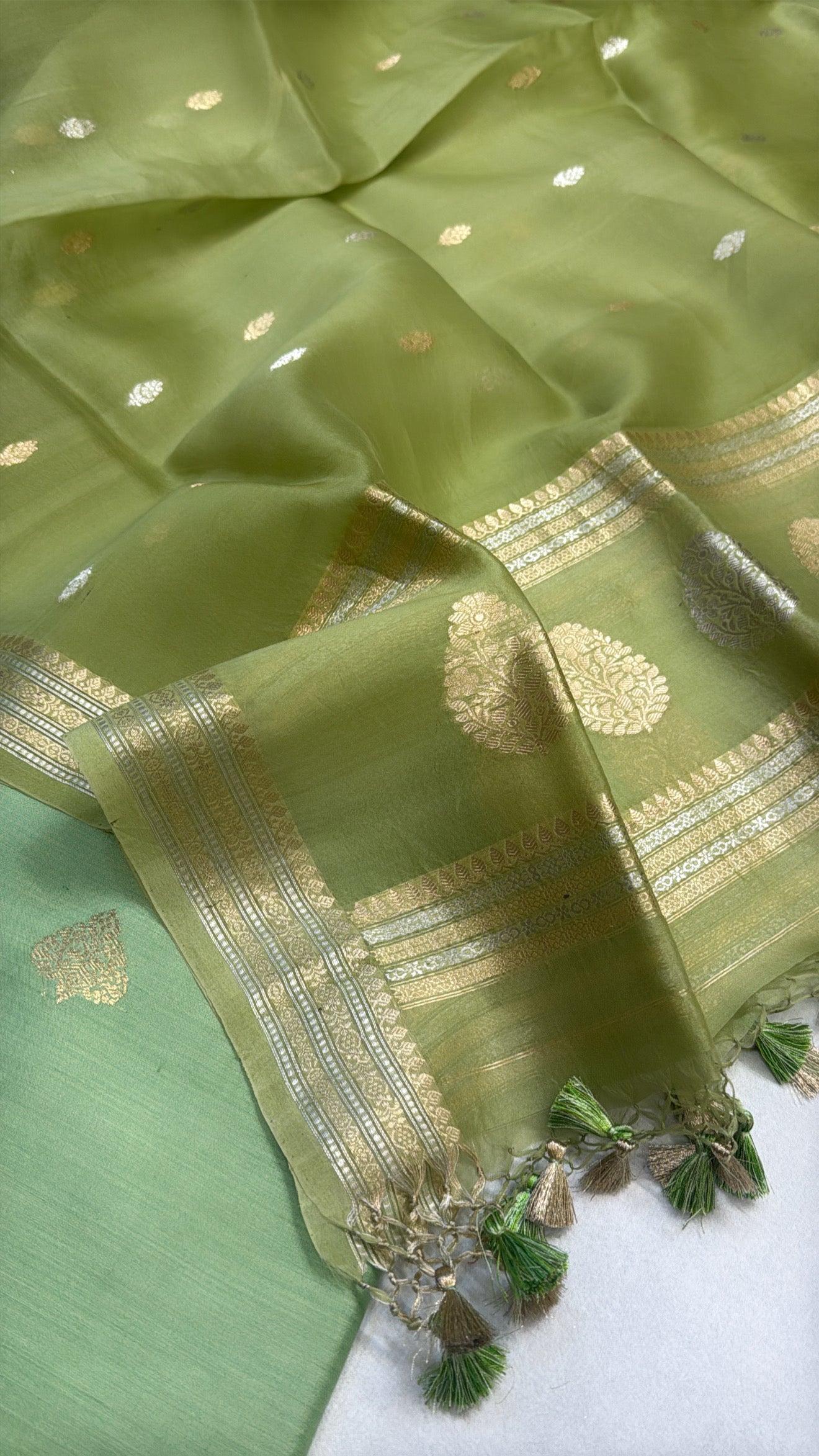 Tea green chiniya silk kurta paired with kora silk kadhwa duppata