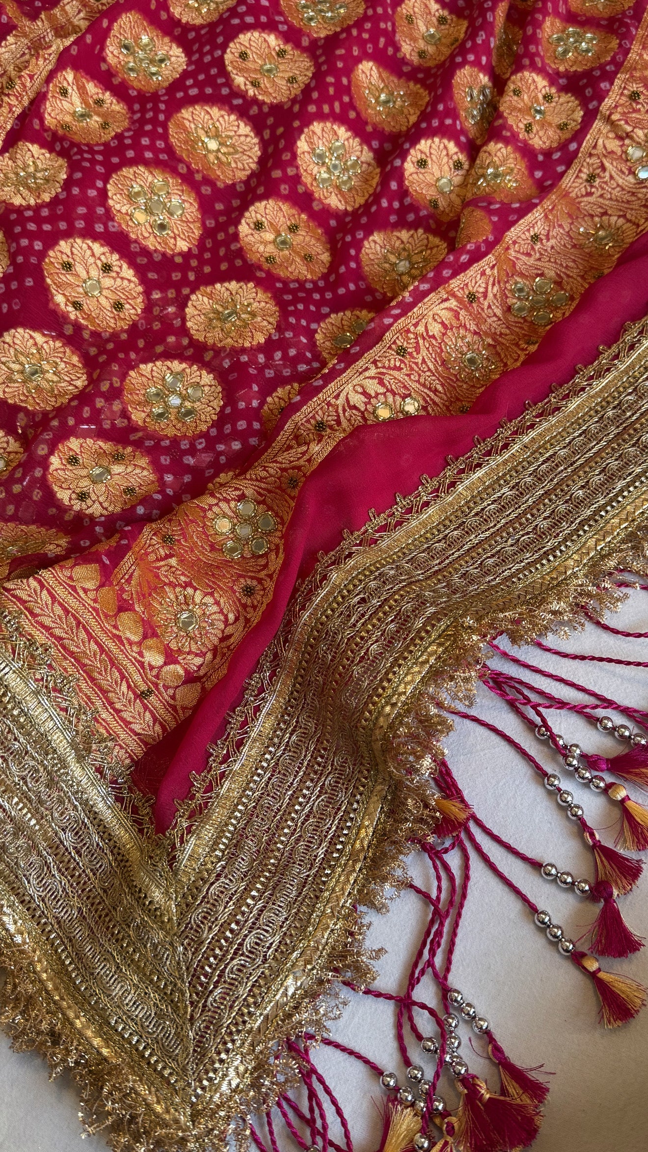 Cherry pink rai bandhej mirror work banarasi gorgette saree with long latkans