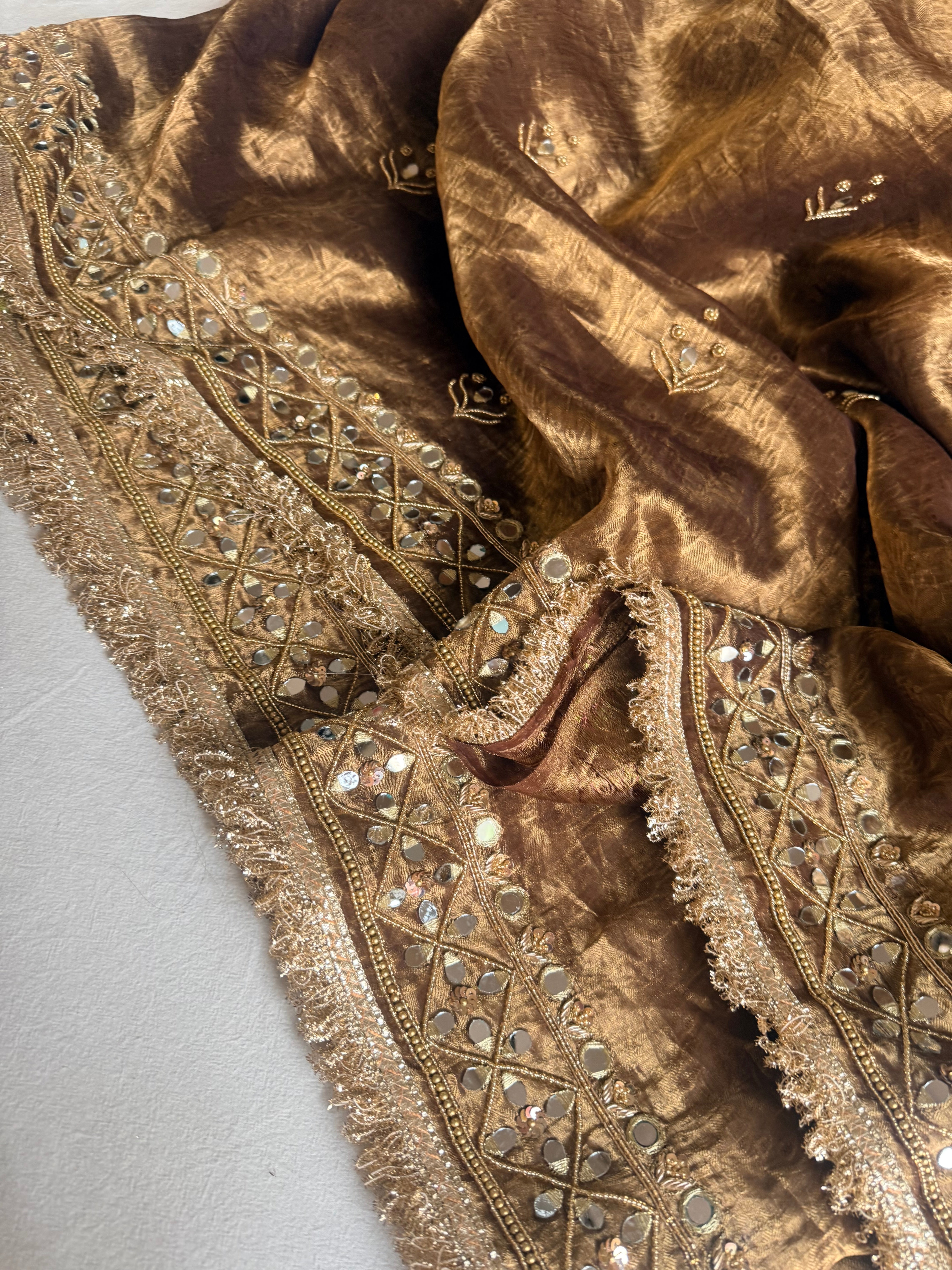Molten antique gold tissue silk mirrorwork hand embroidered saree