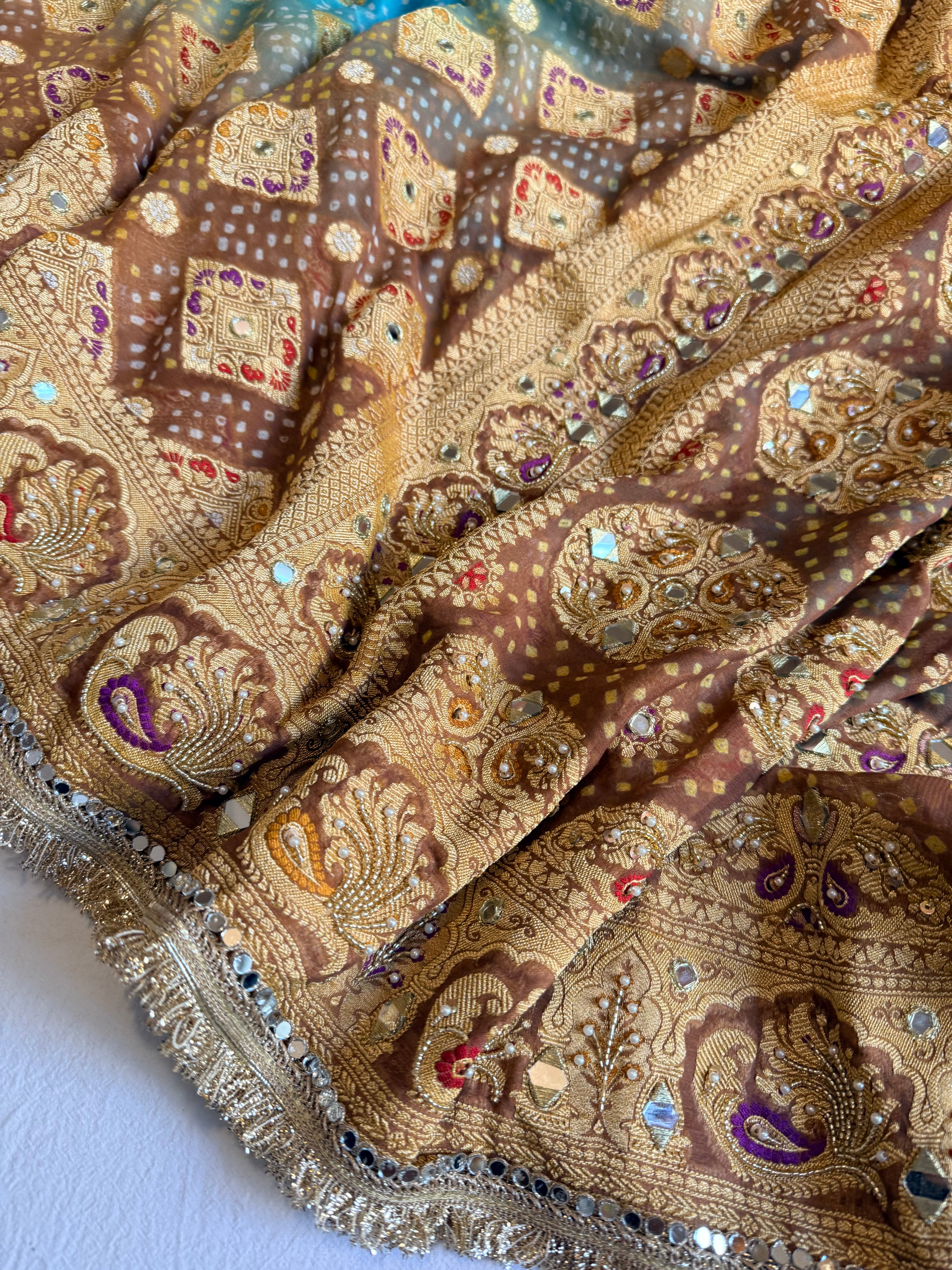 Banarasi blush shades of chiffon rai bandhej mirror work hand embroidered saree