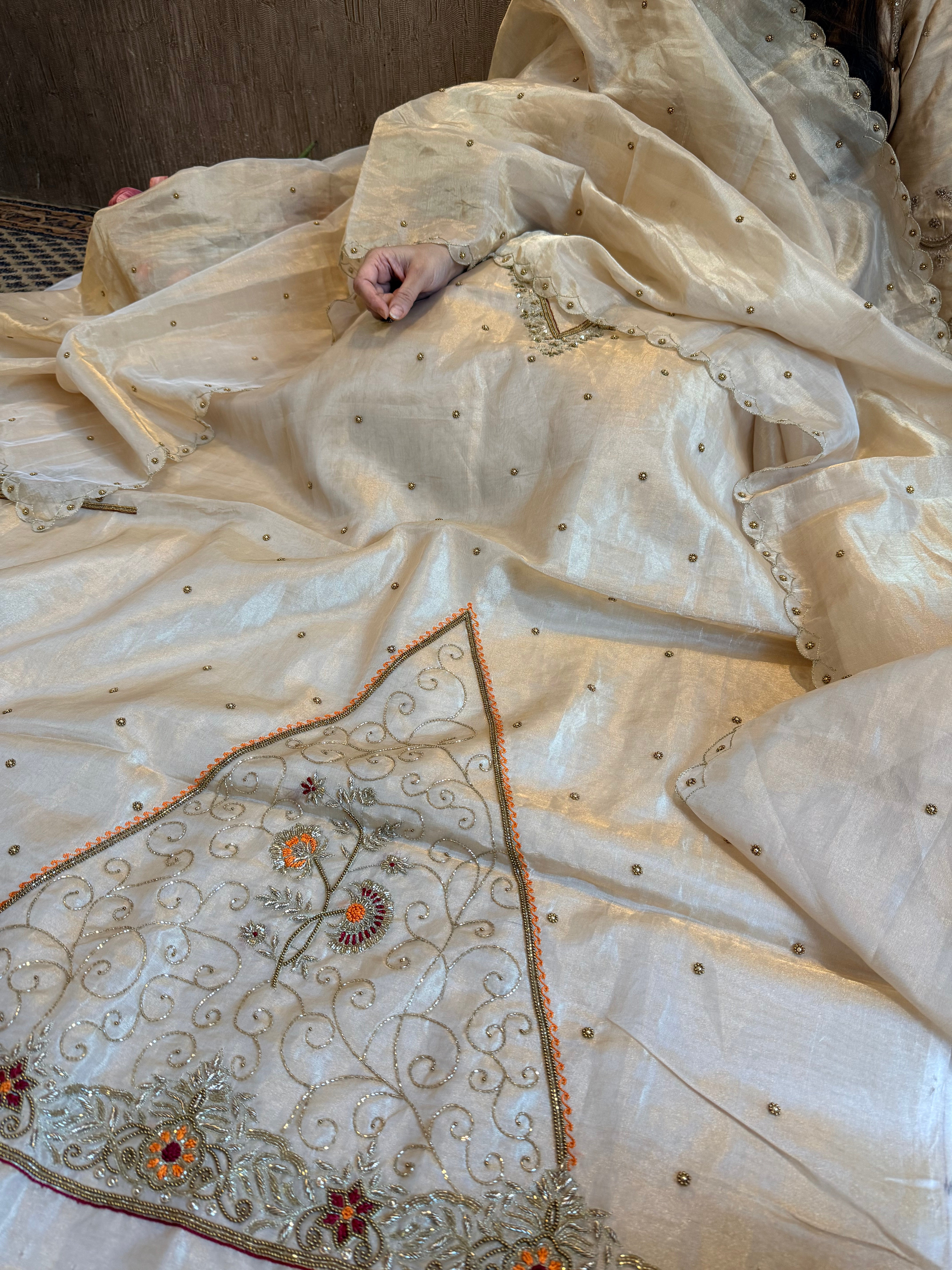 Golden tissue silk meenakari weaving hand embroidered suits