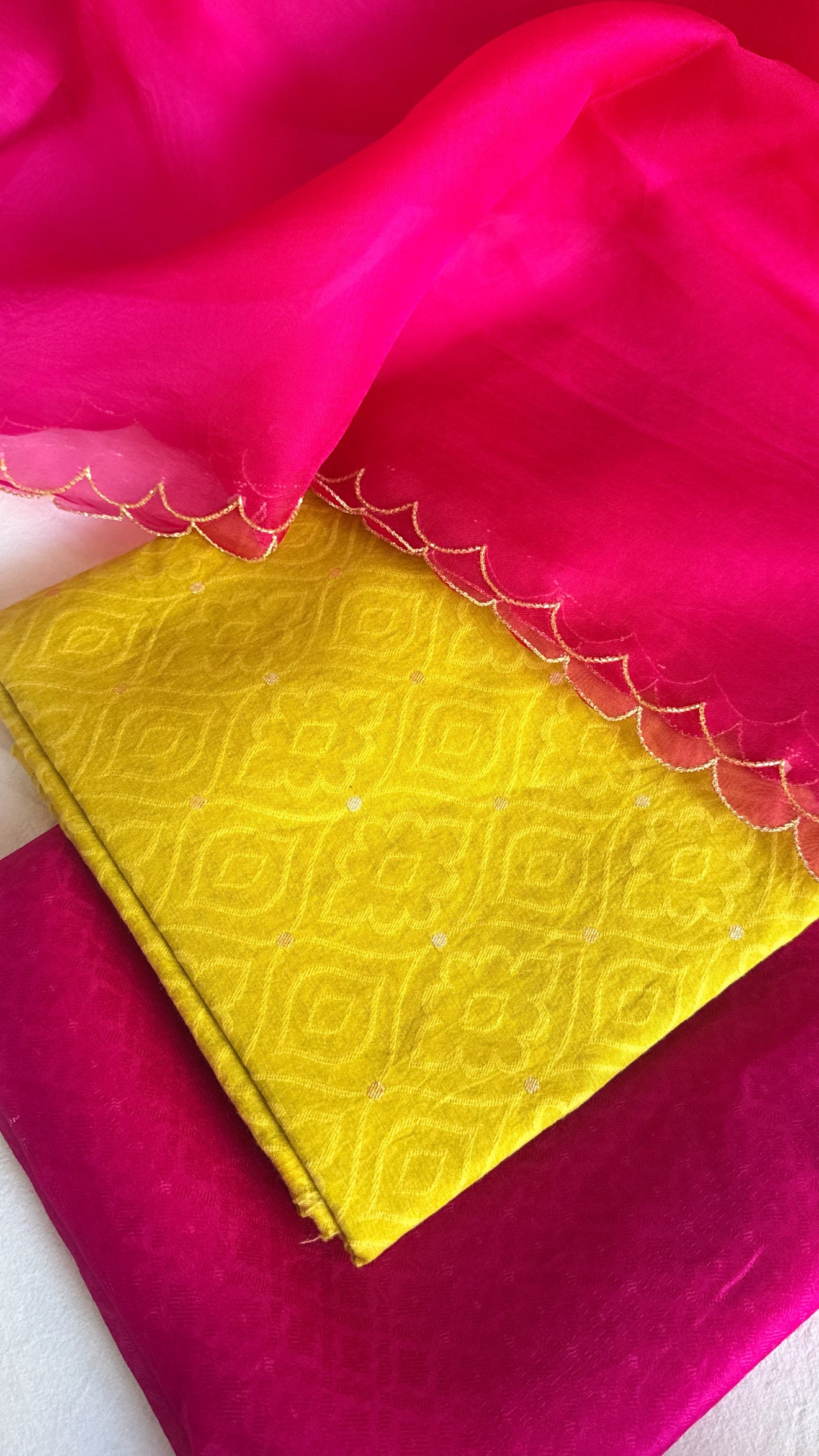 Summer suits under 8k - Mul cotton yellow kurta paired with rani scalloped kora silk duppata