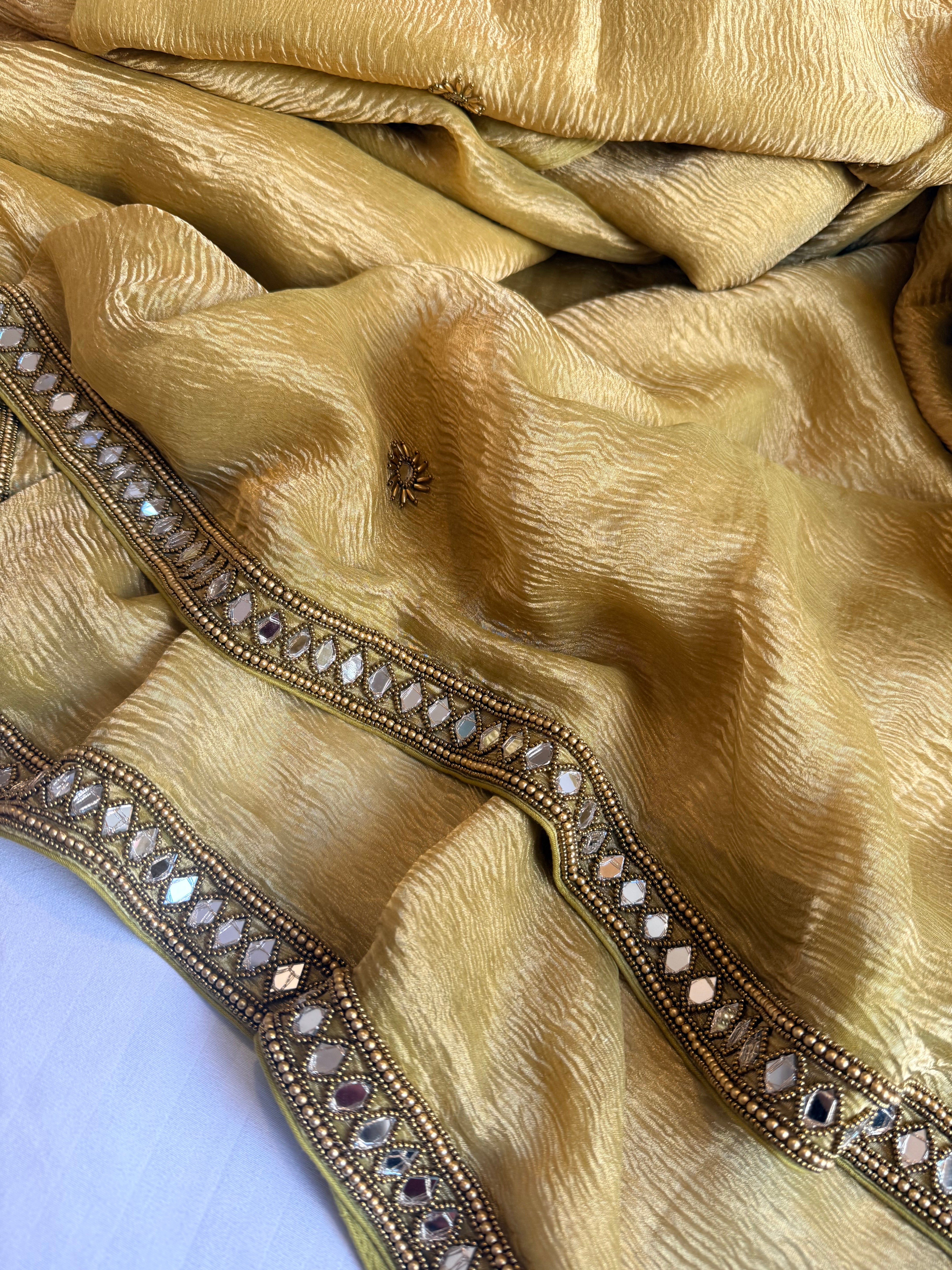 Mirrorwork edit mustard gold crushed tissue silk hand embroidered saree