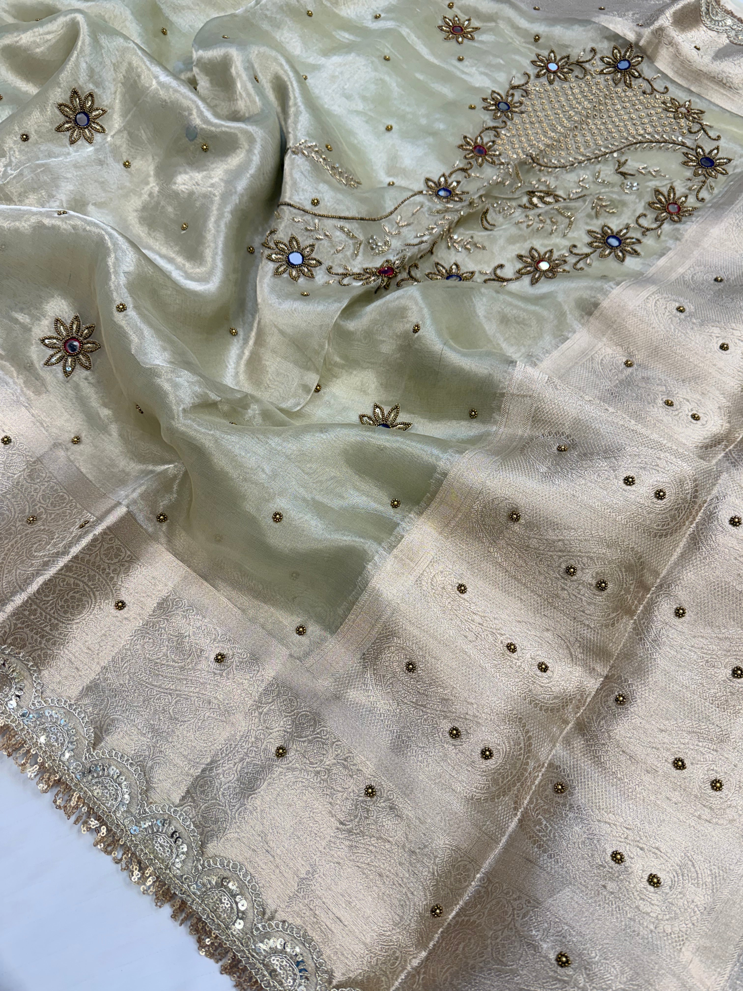Mint green husn tissue silk carry motif hand embroidered saree