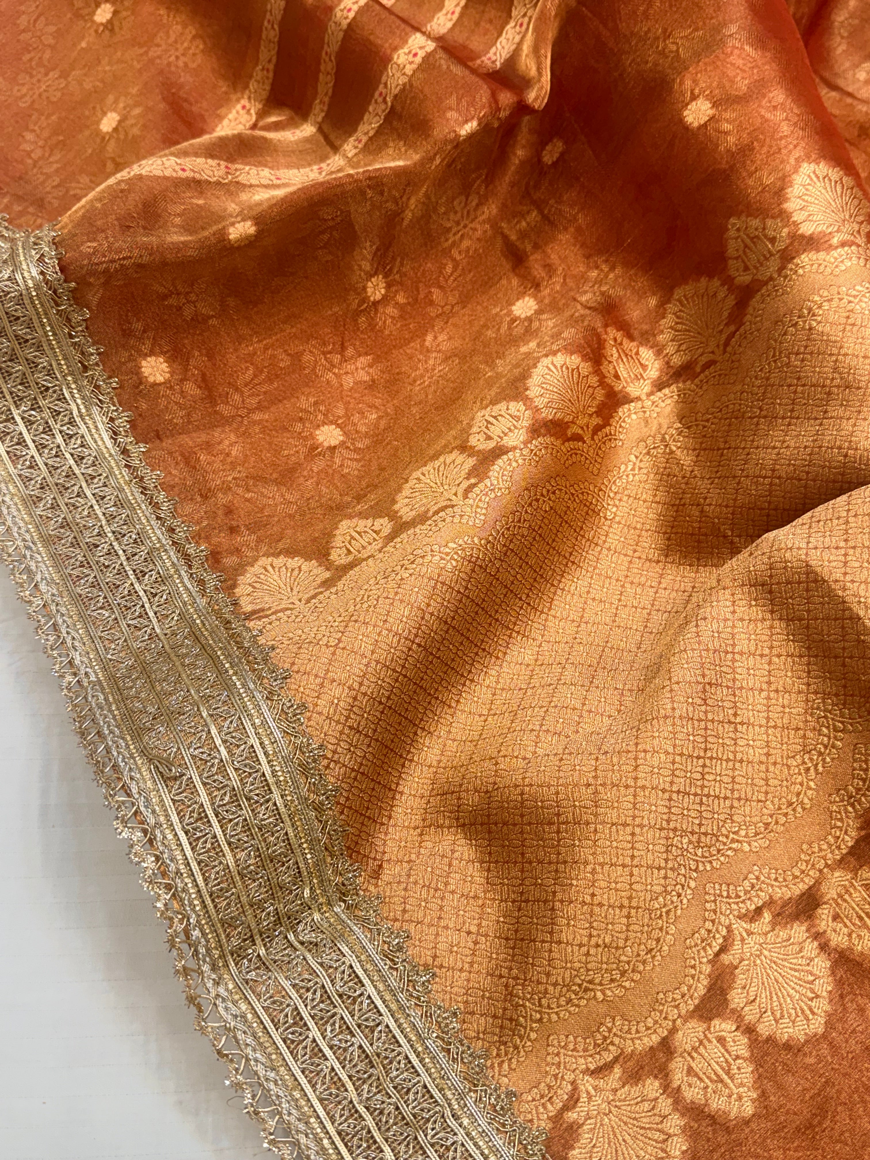 Tangerine red tissue silk kadhwa buti and striped gotapatti saree