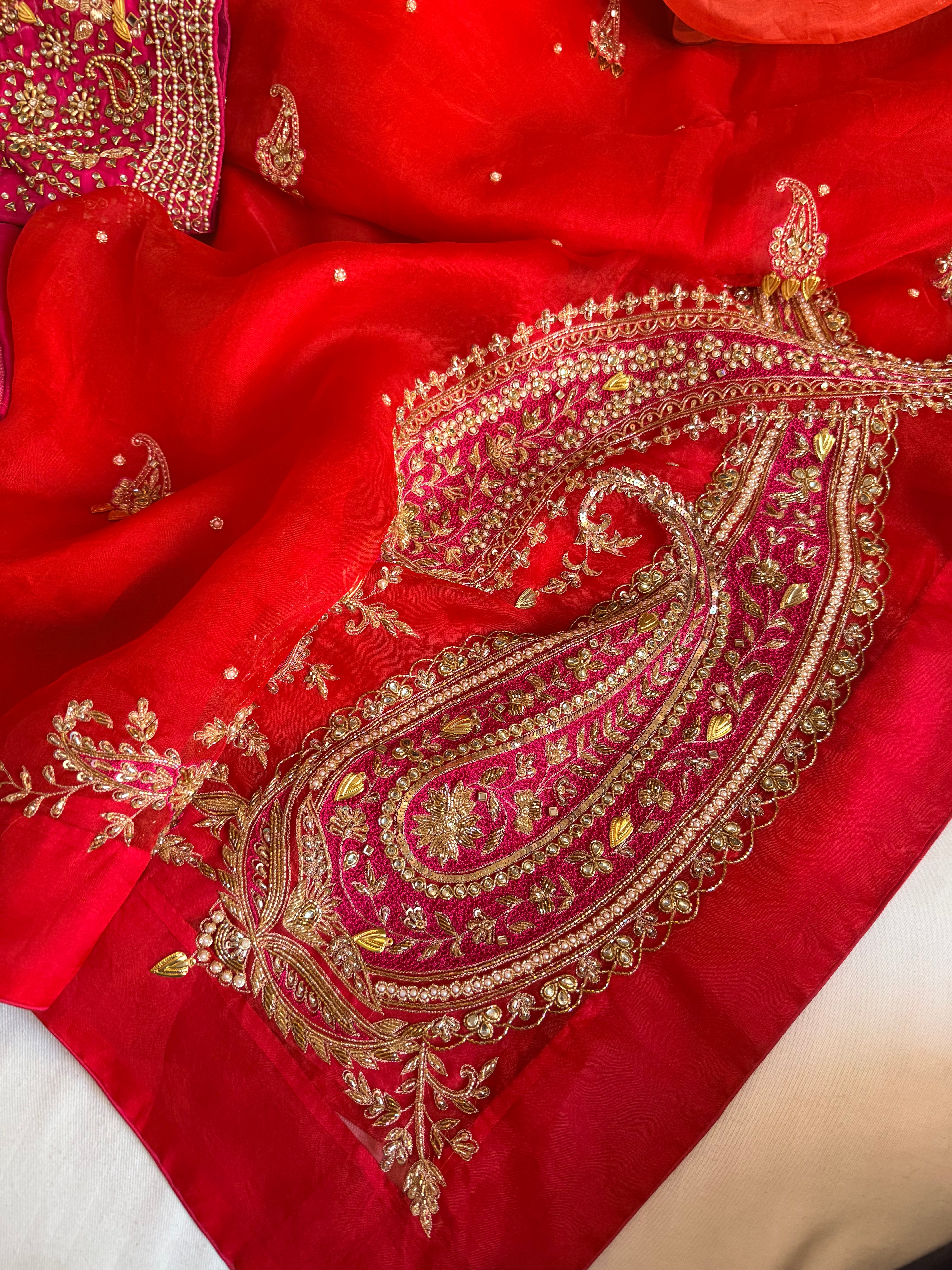 Traditional carry motif - rani and red combination kora silk hand embroidered saree