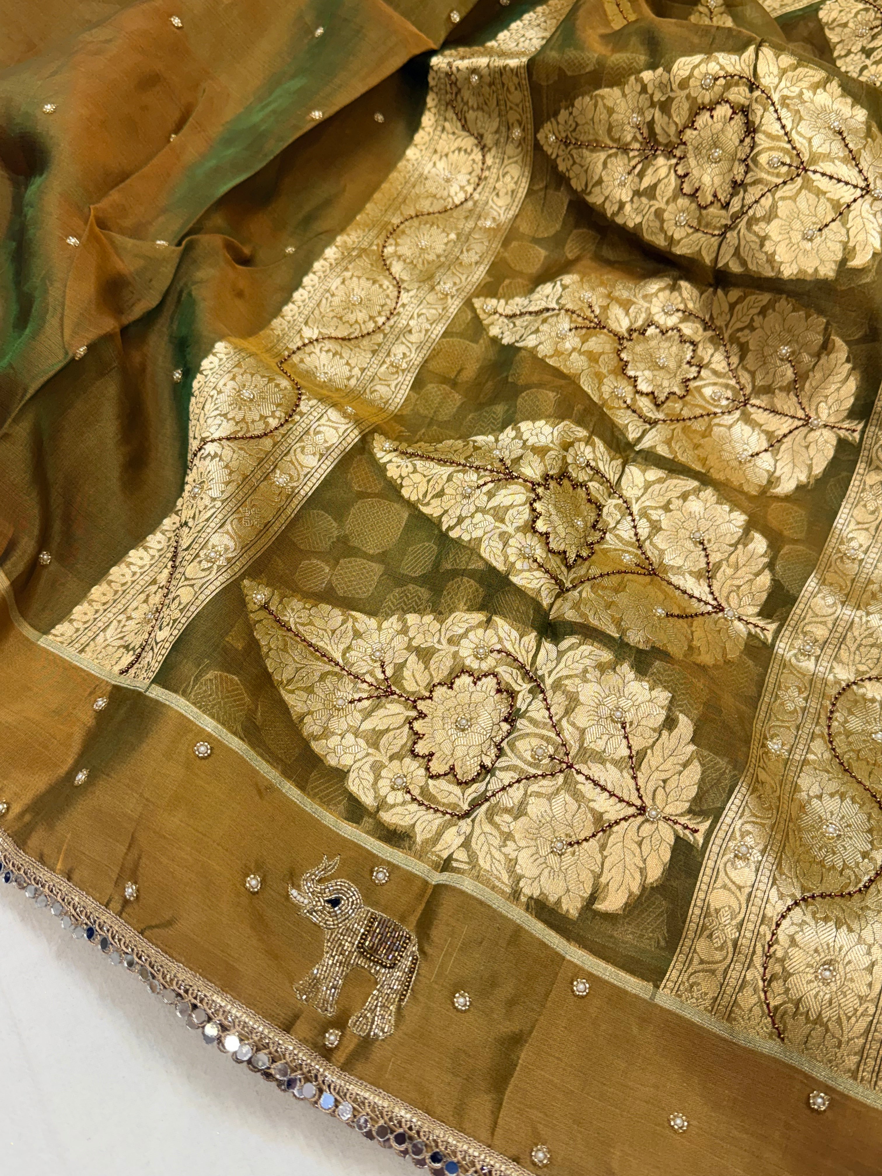 Mehendi green dhup chao effect tissue silk hand embroidered saree