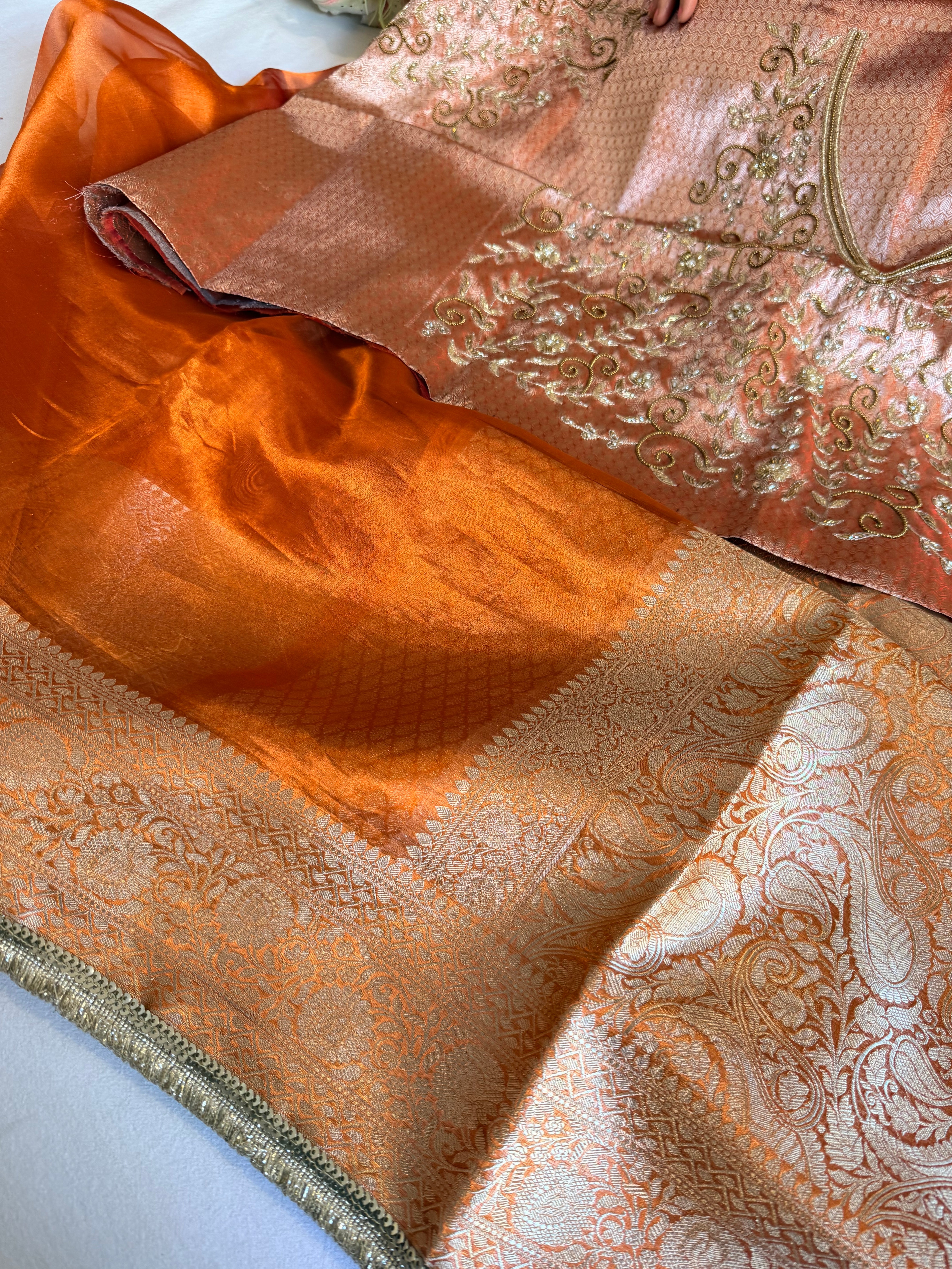 Metallic orange husn tissue silk hand embroidered saree with heavy blouse