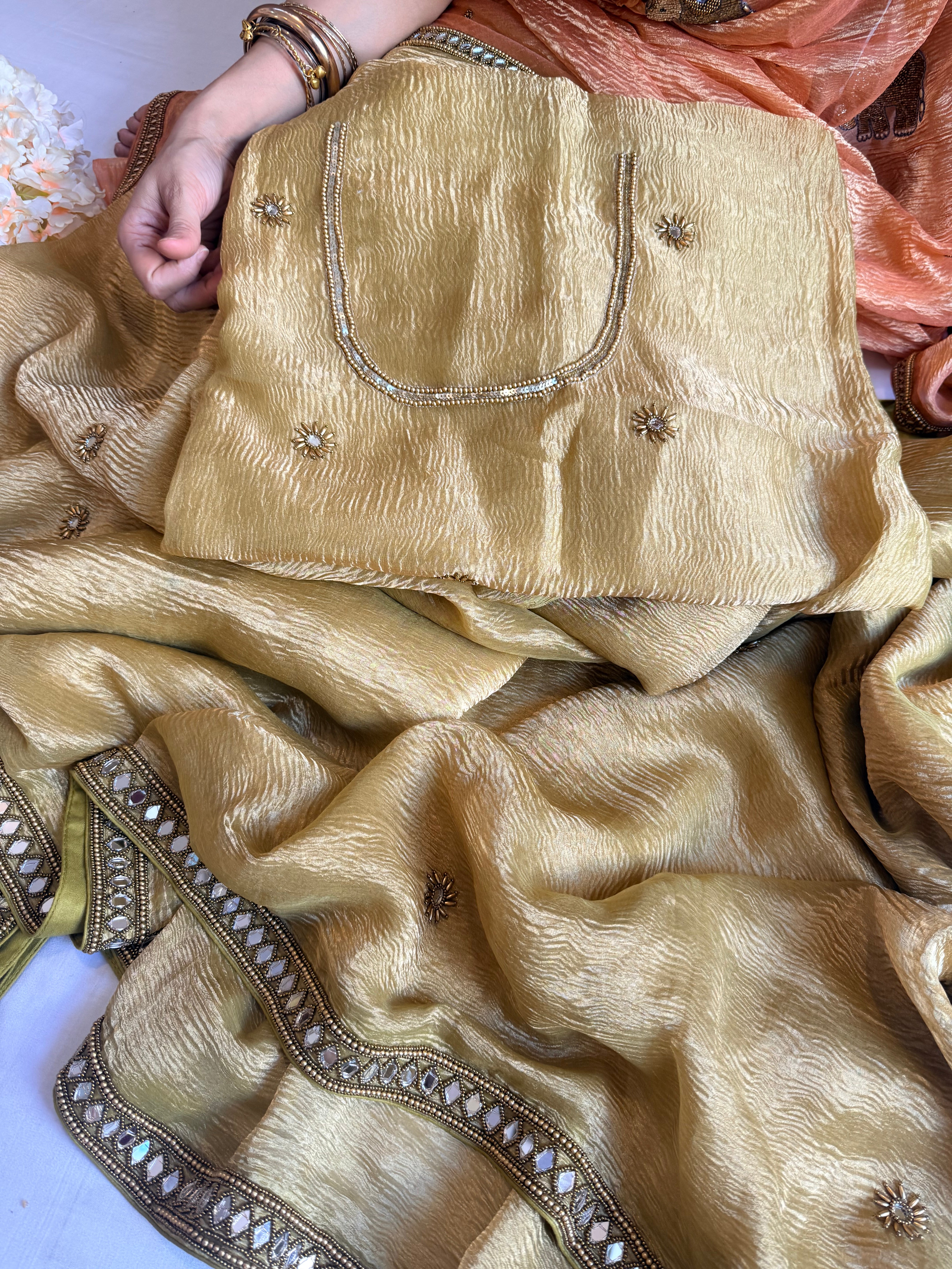 Mirrorwork edit mustard gold crushed tissue silk hand embroidered saree