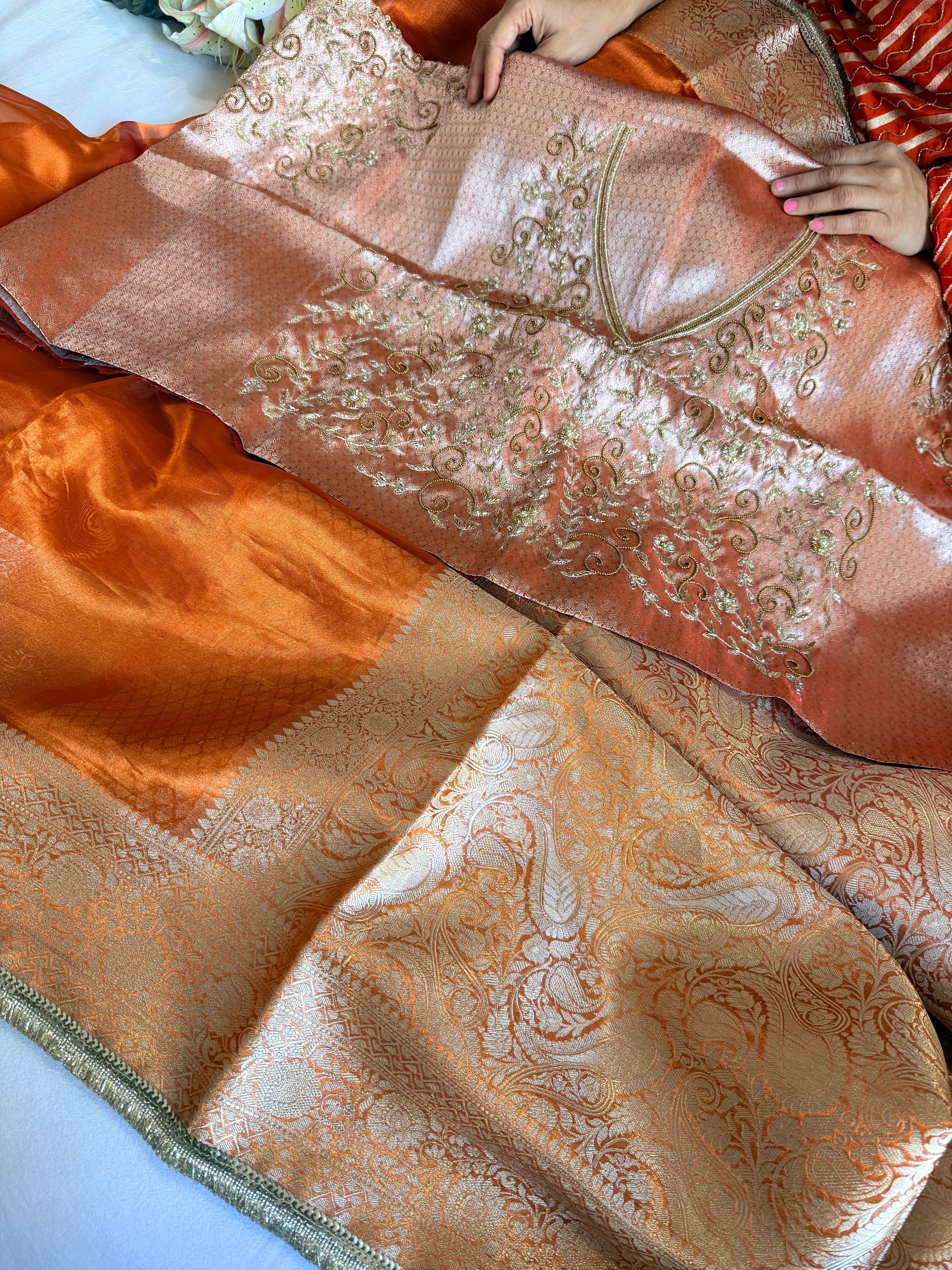 Metallic orange husn tissue silk hand embroidered saree with heavy blouse
