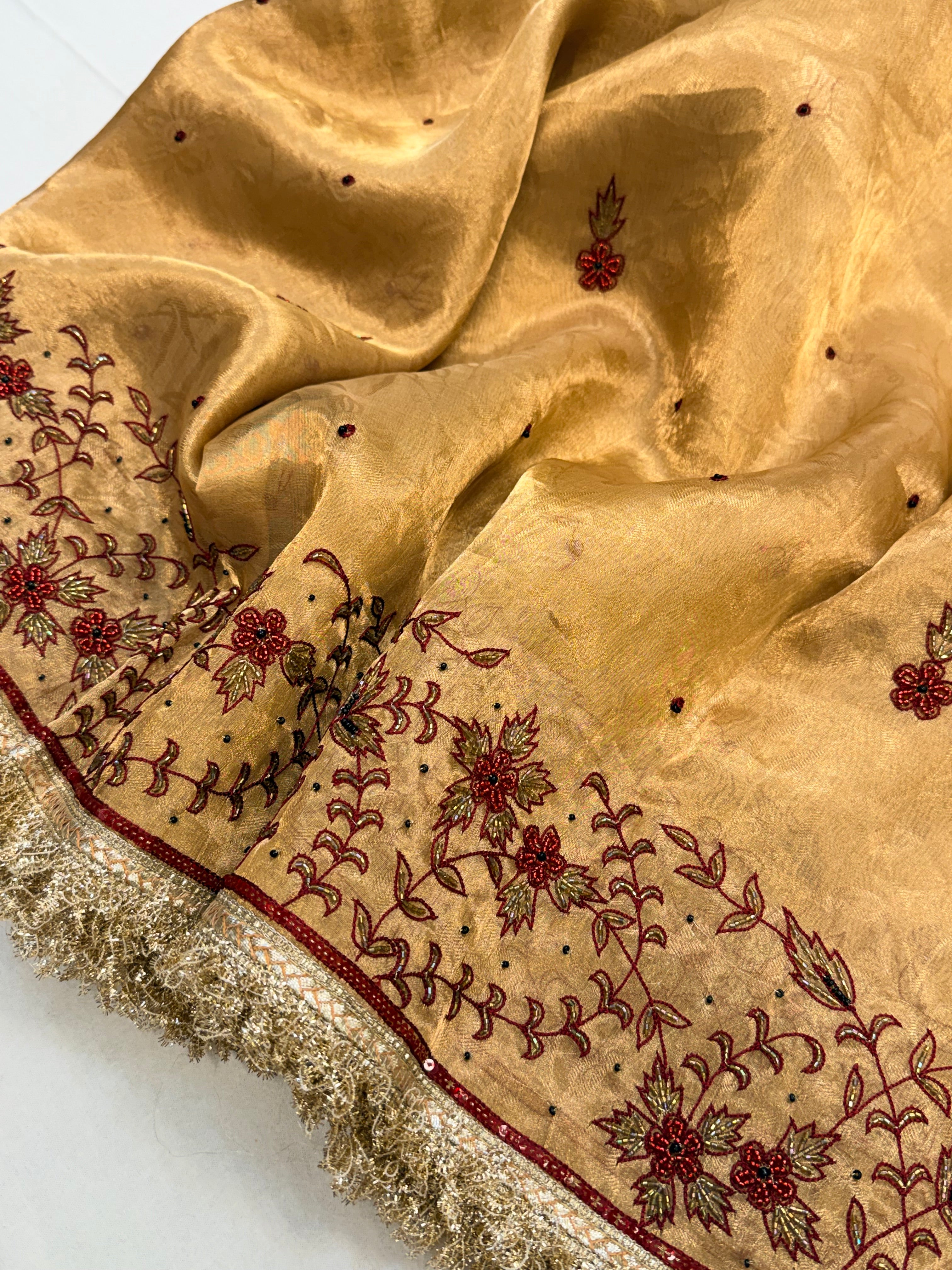Molten gold tissue silk hand embroidered kadhwa saree