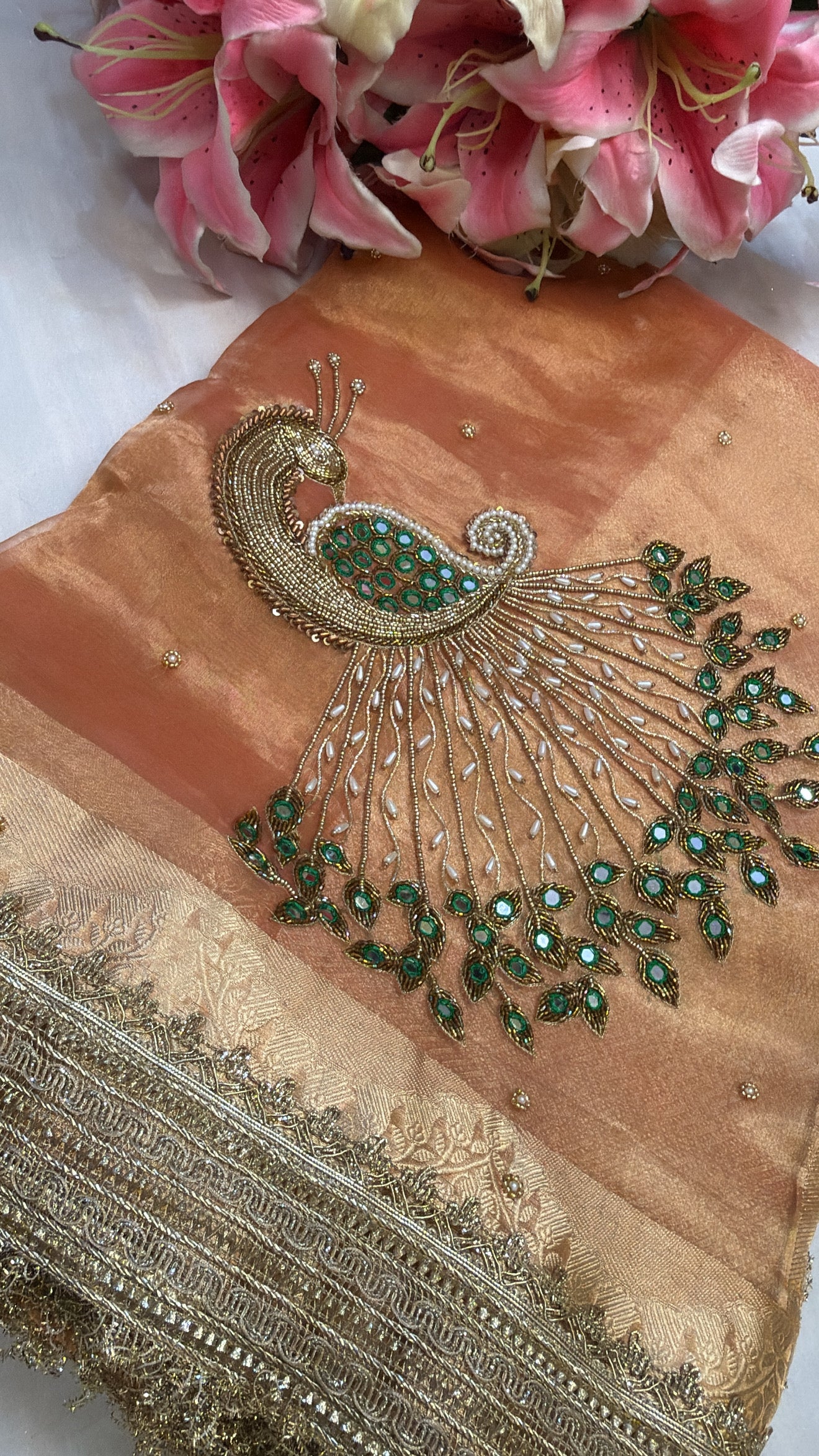 Peachish orange peacock motif hand embroidered kadhwa saree