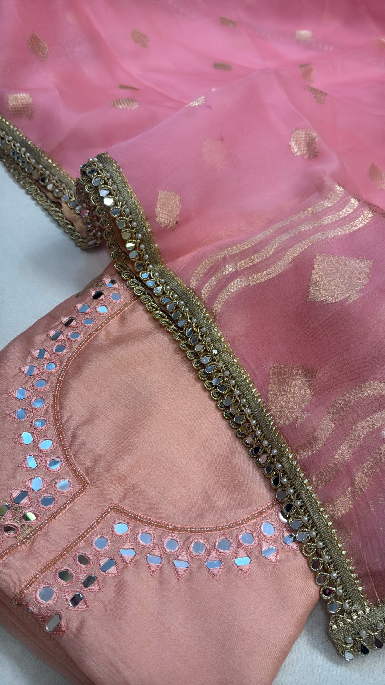 Peachy pink chiniya silk kadhwa kurta paired with kora silk kadhwa duppata