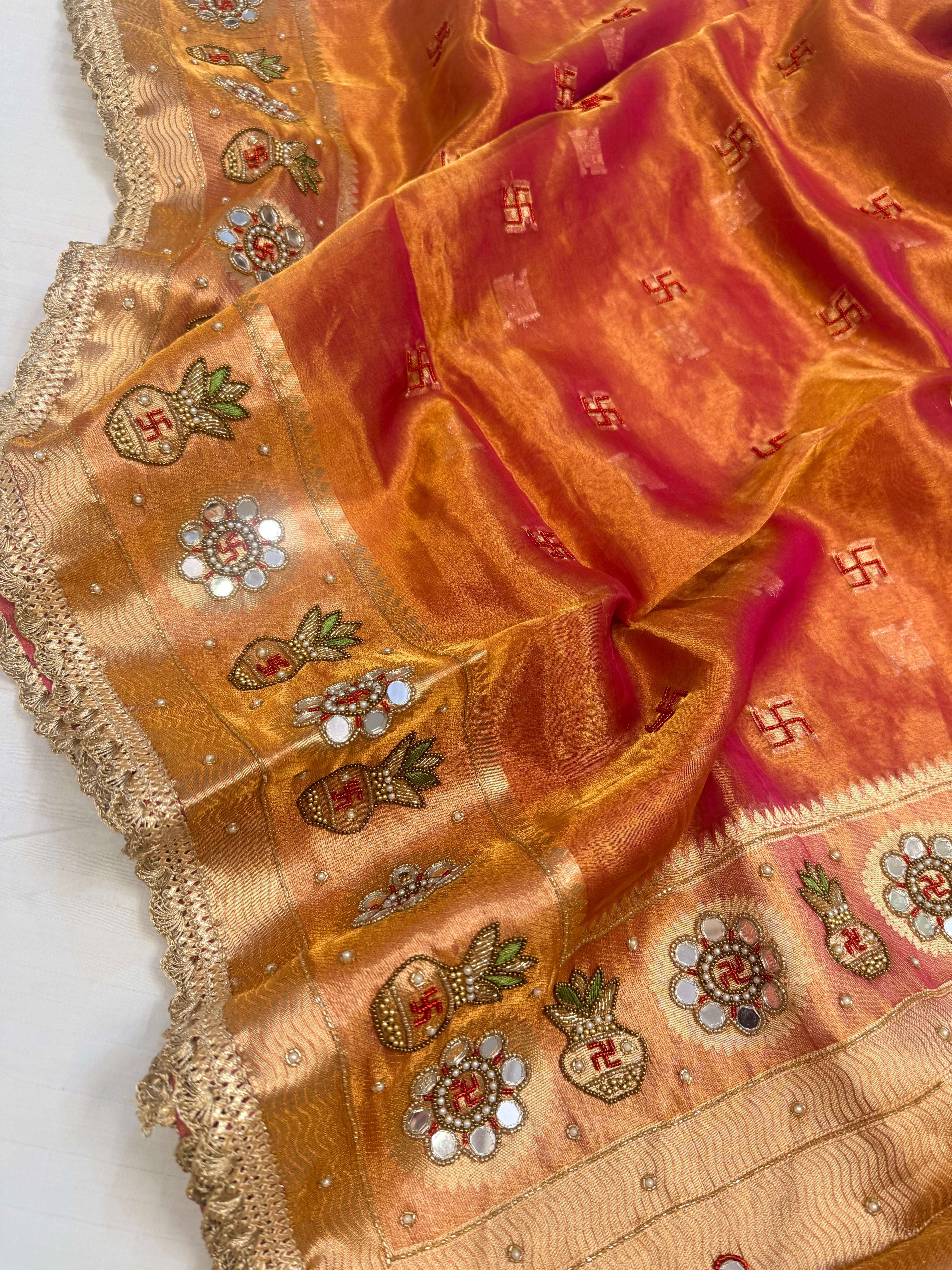 Metallic rani-orange dhup chao tissue silk hand embroidered mirrorwork saree