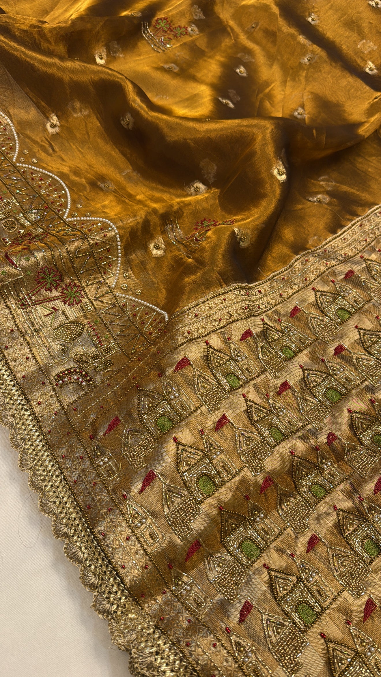 Gangakinare edit molten gold tissue silk hand embroidered saree