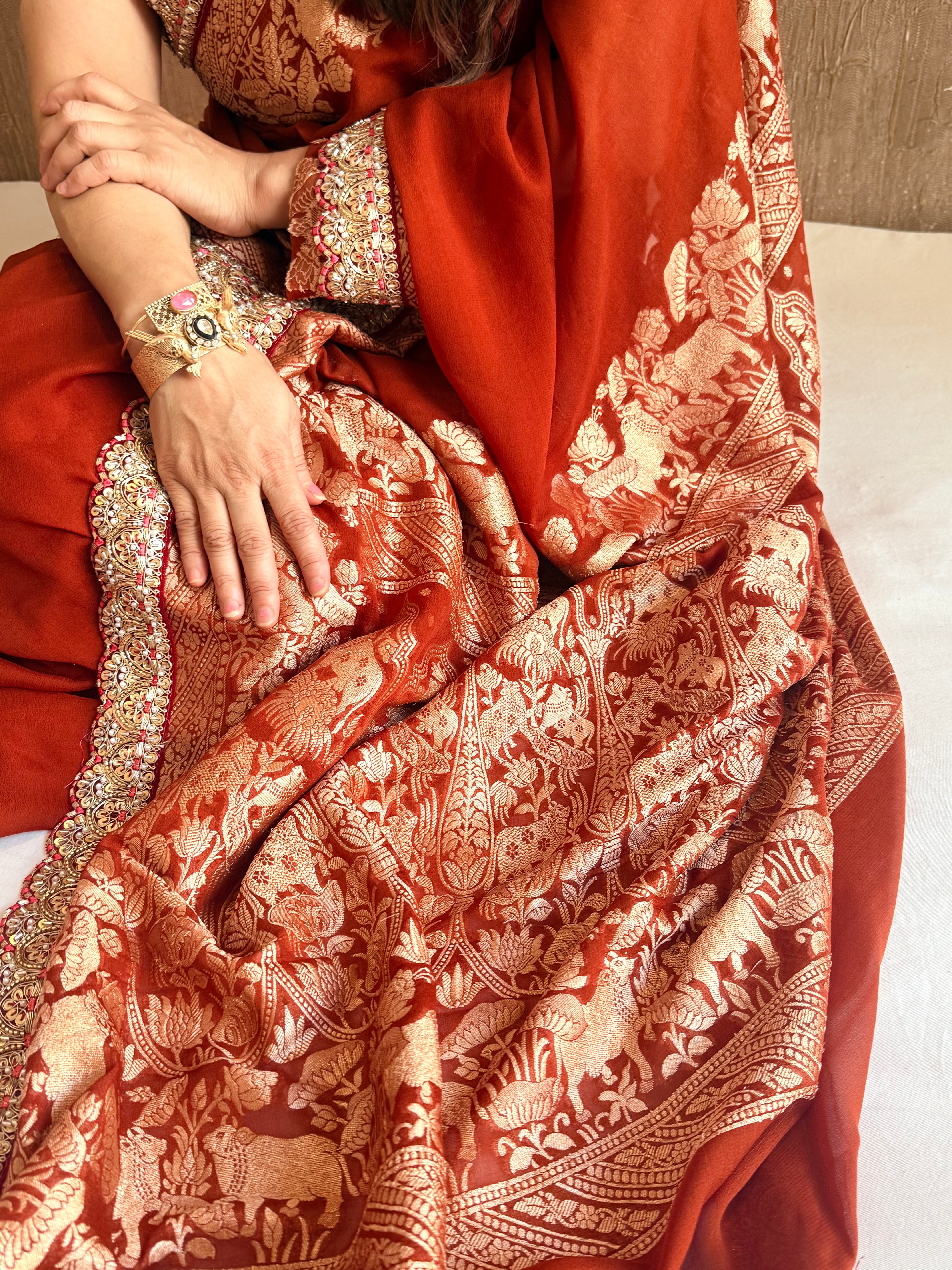 Brick red shikargah kadhwa border chiffon gorgette banarasi saree