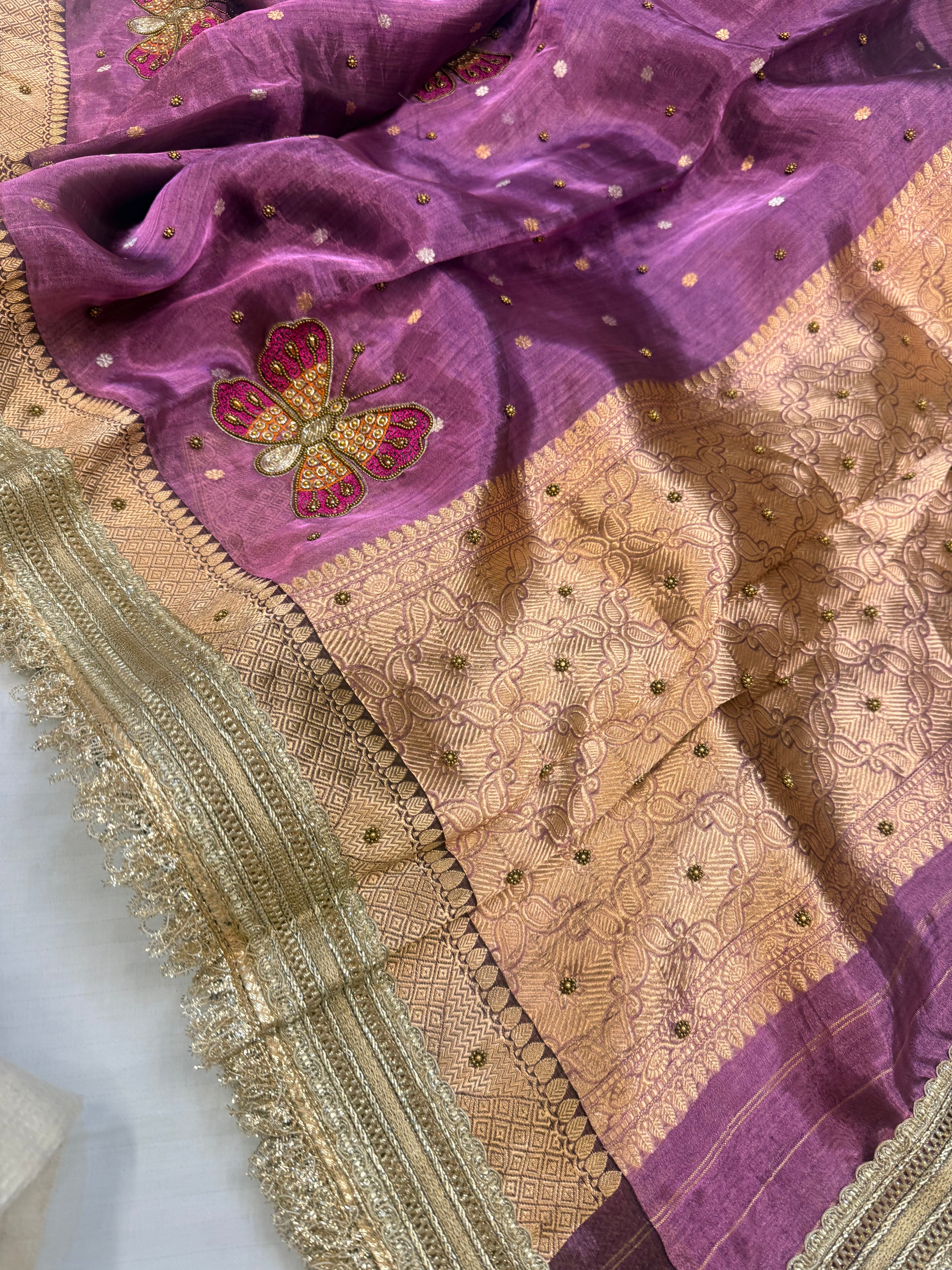 Metallic brinjal purple husn tissue silk hand embroidered saree