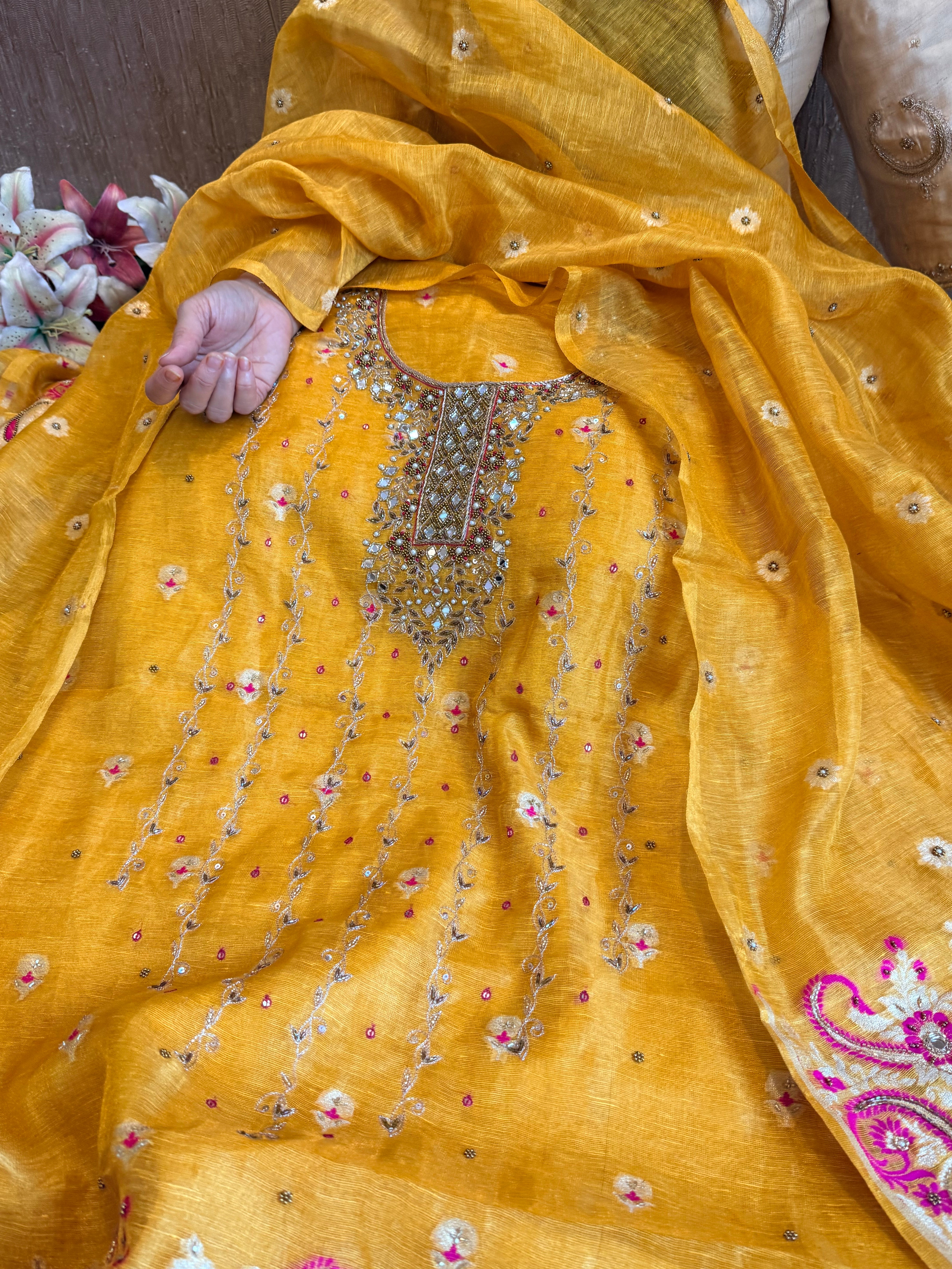 Haldi yellow mul linen tissue silk meenakari hand embroidered suits