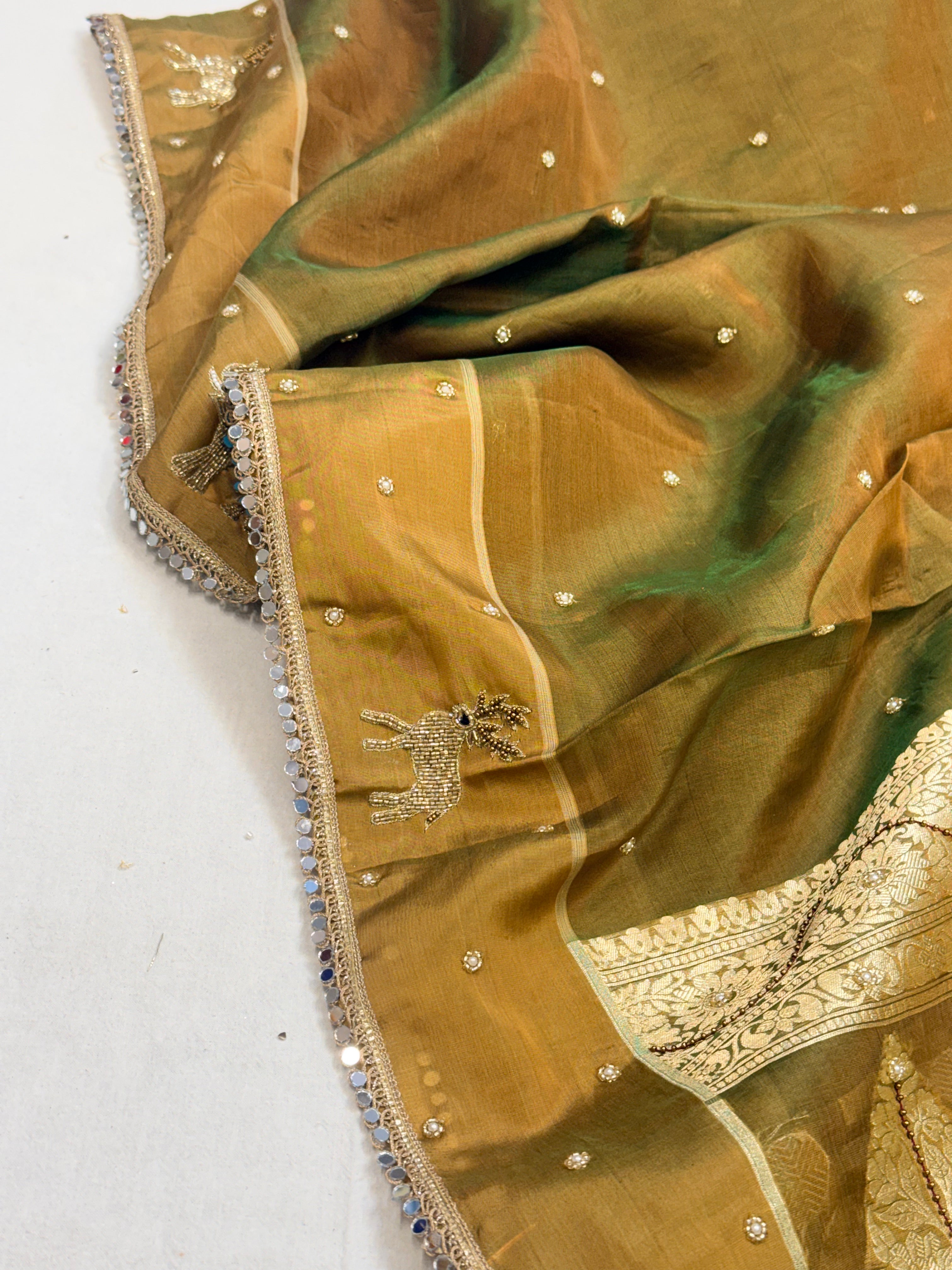 Mehendi green dhup chao effect tissue silk hand embroidered saree